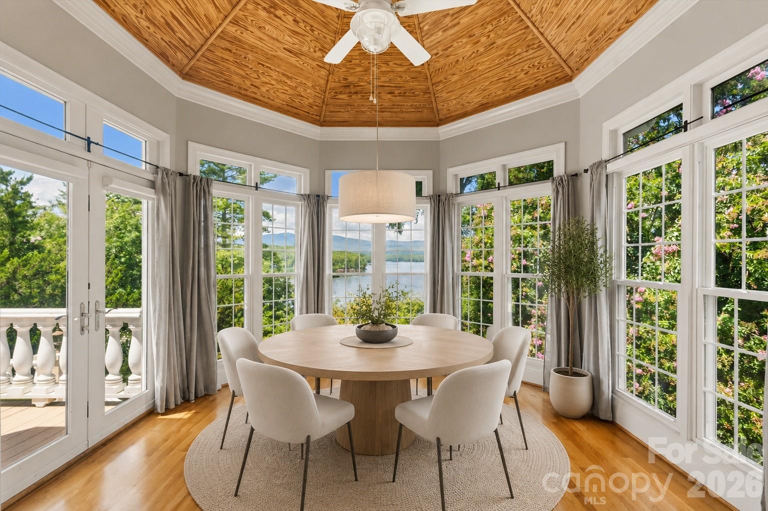 Virtually staged dining with lake views - 705 Lake Club Drive, Nebo