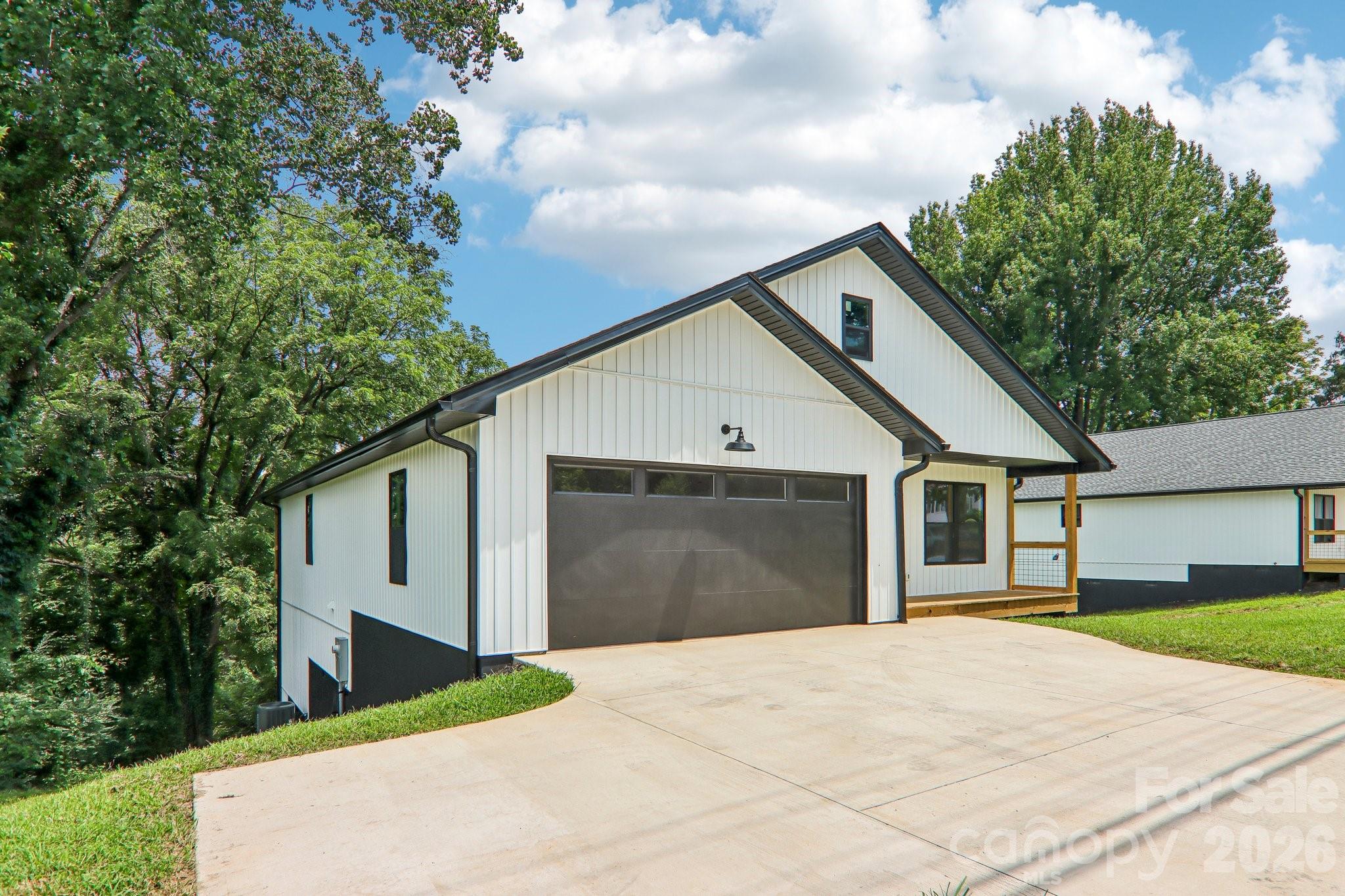 Double garage with extra parking pad. - 140 N Main Street, Mars Hill