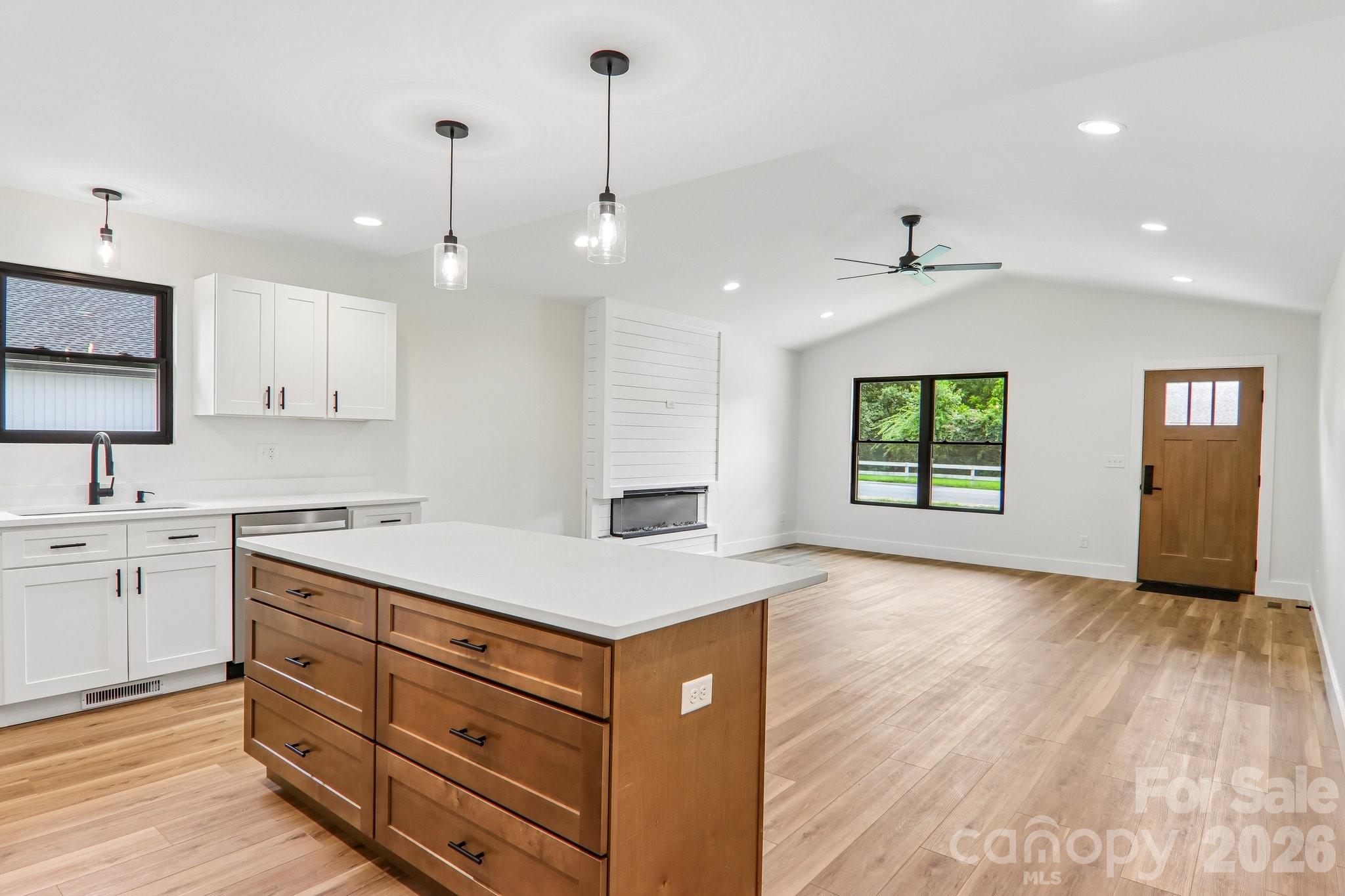 Kitchen island with seating and custom drawer base cabinet with soft close. - 140 N Main Street, Mars Hill
