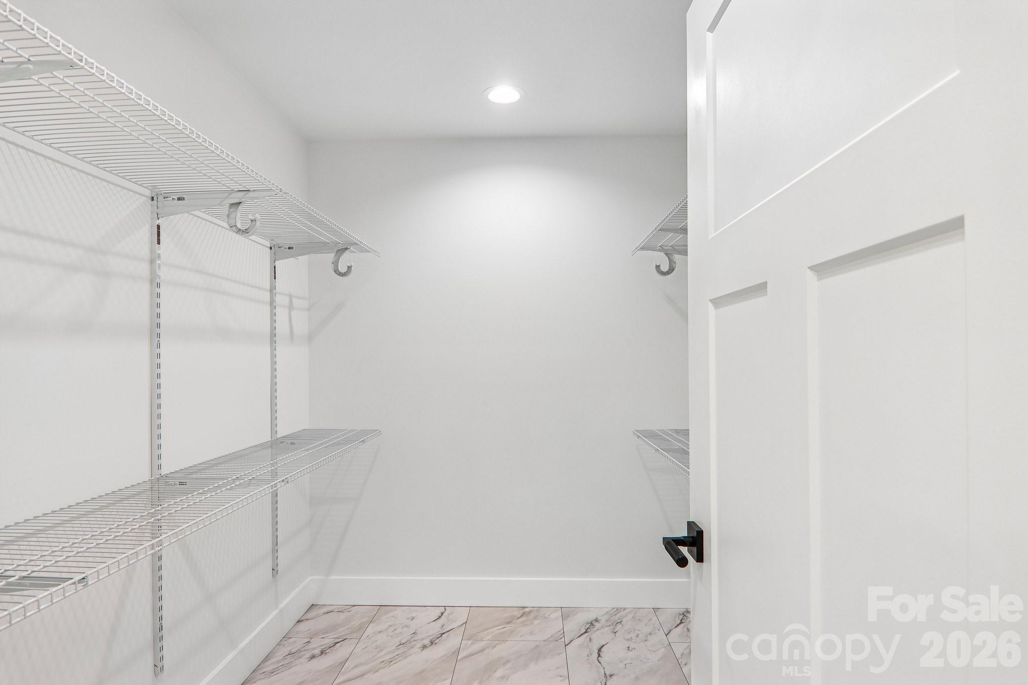 Walk-in primary closet. - 140 N Main Street, Mars Hill
