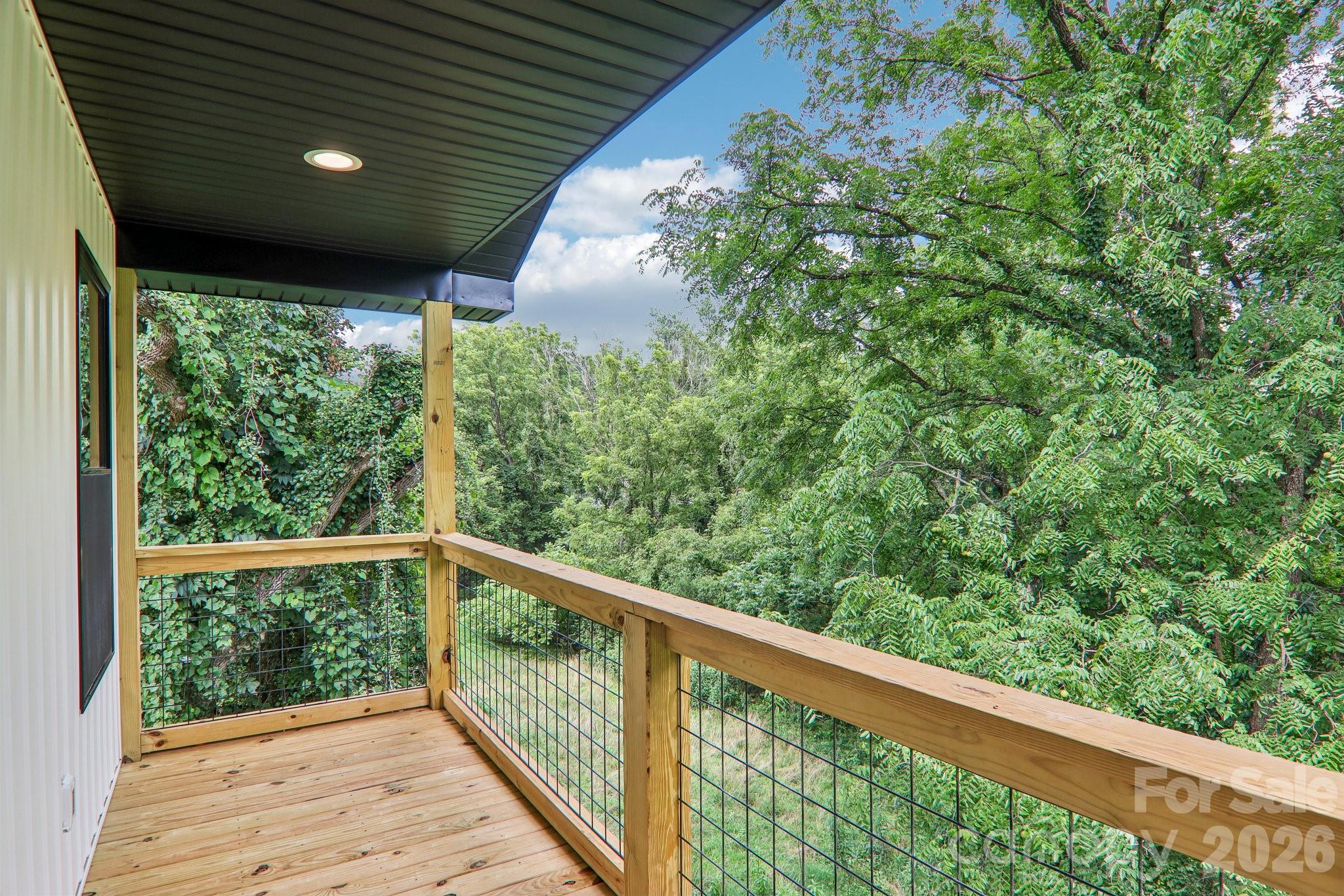 Covered back deck for sunrise's & morning coffee. - 140 N Main Street, Mars Hill