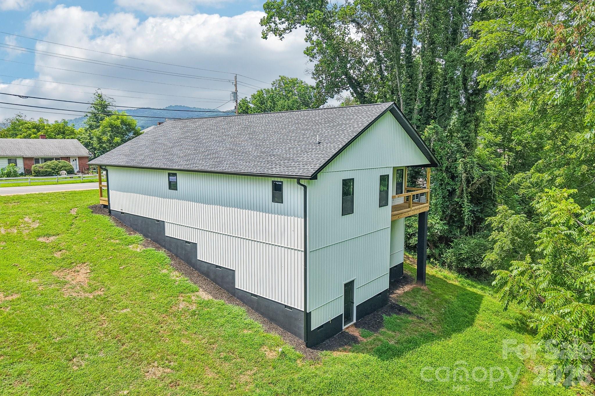 Large lower level for mechanicals has gravel floor bed. This space offers endless possibilities. - 140 N Main Street, Mars Hill