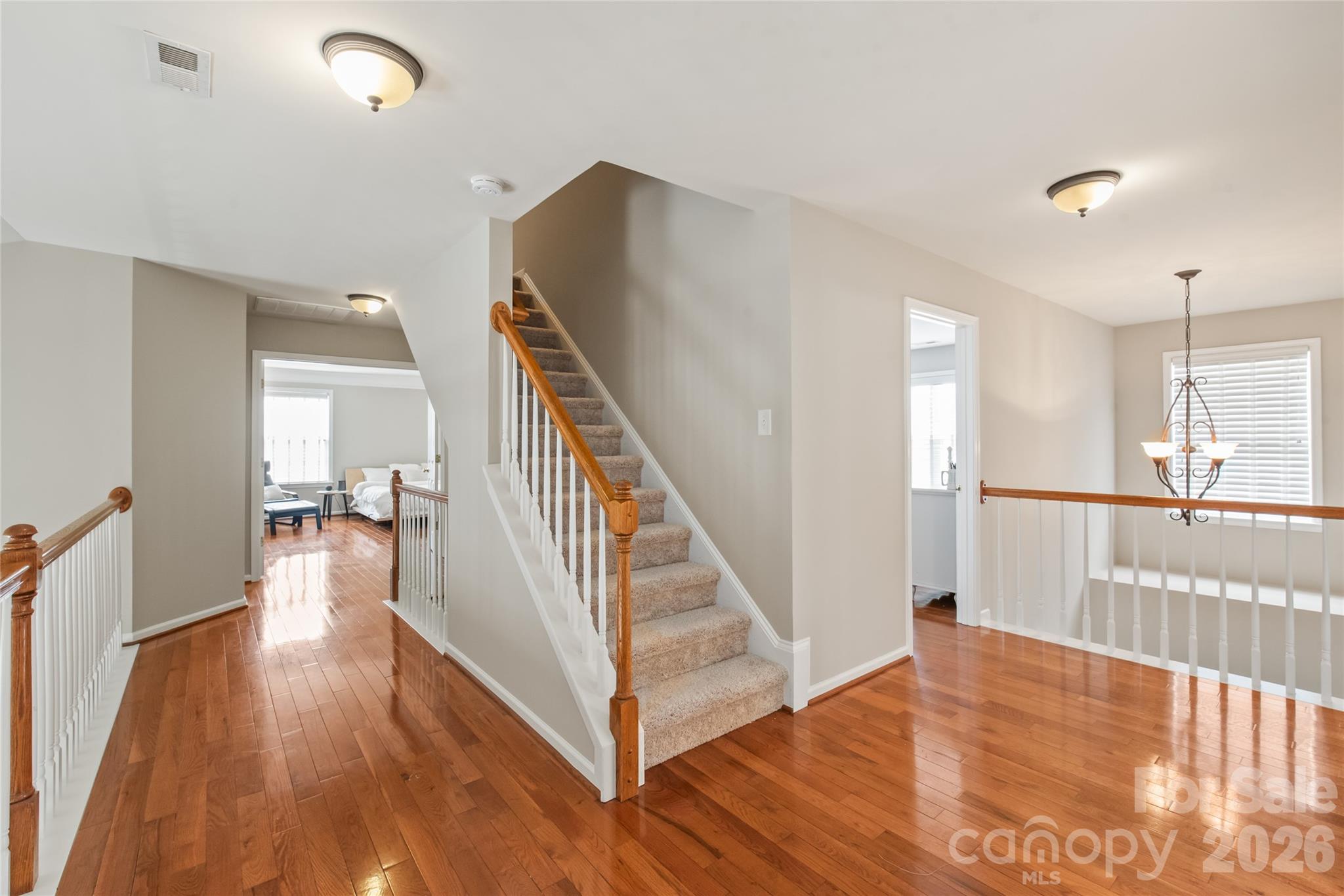 Hardwood floors carry through to the second floor. Primary suite to the left with three guestrooms to the right - 1906 Birchbrook Court, Harrisburg