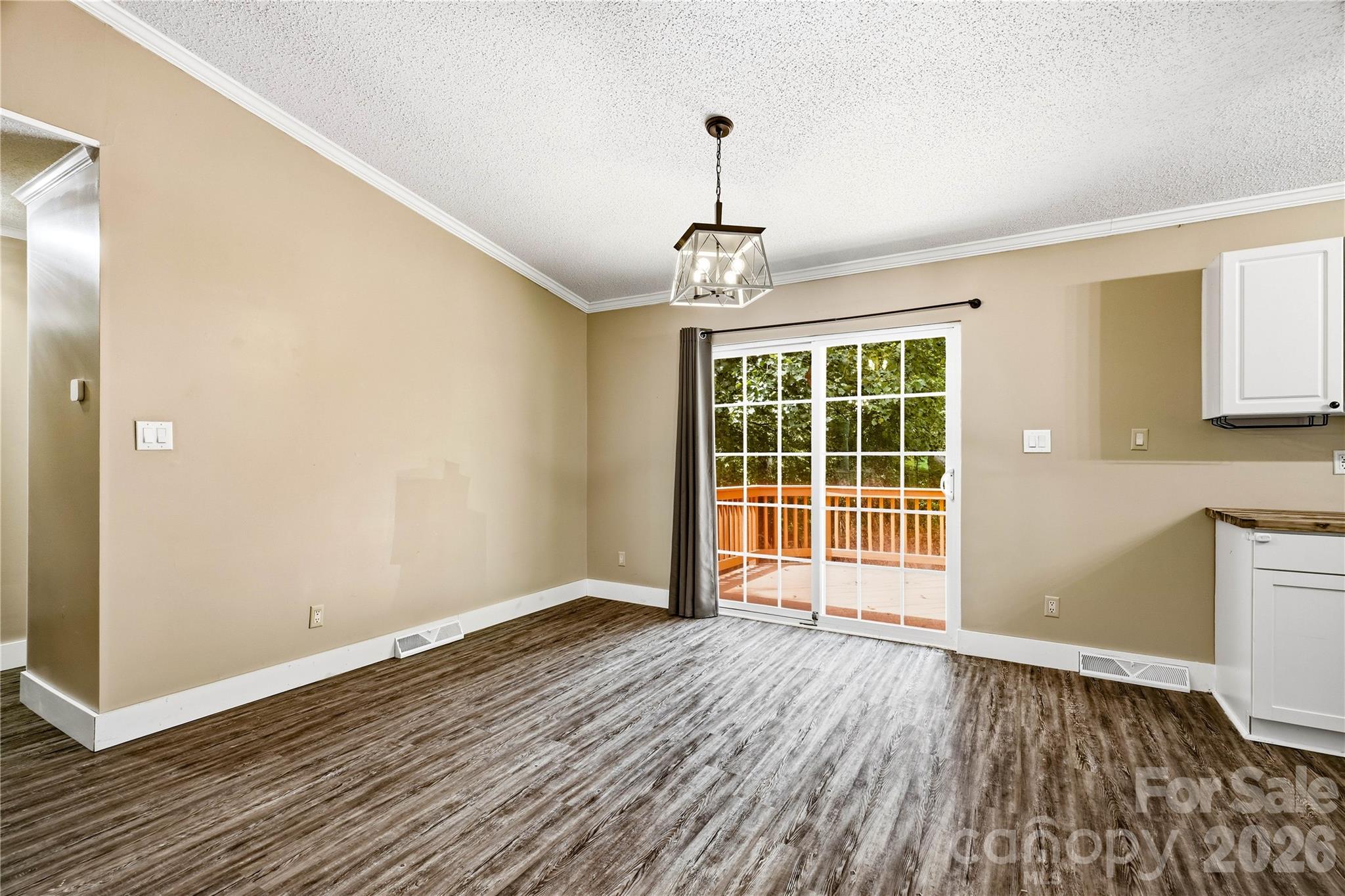 Dining area with walkout sliders to deck - 3555 Lake Bluff Drive, Sherrills Ford
