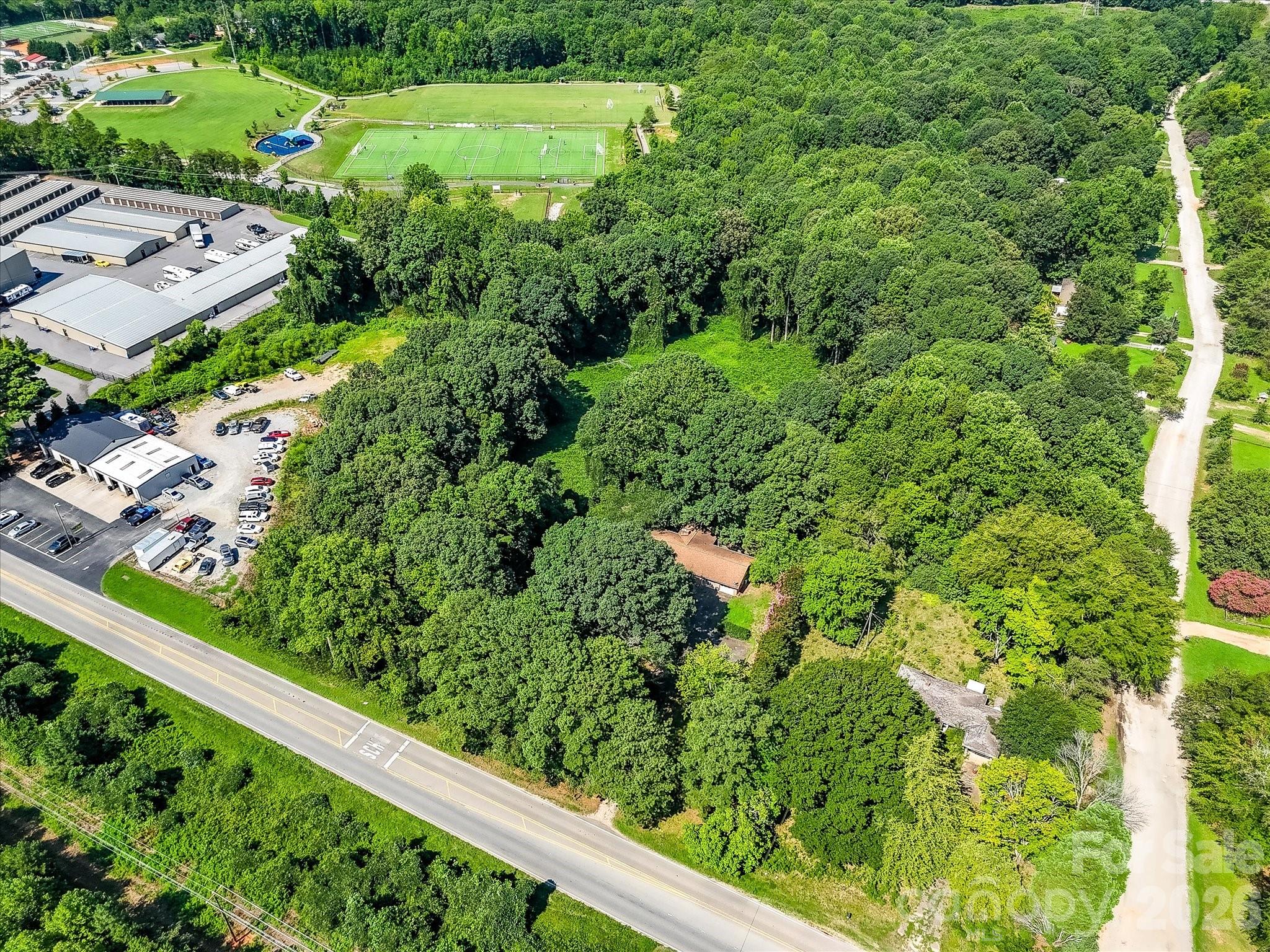 This Denver, NC commercial opportunity features a large, wooded parcel with existing improvements and exceptional redevelopment potential in one of the fastest-growing areas. - 1753 N NC Hwy 16 Business Highway, Denver