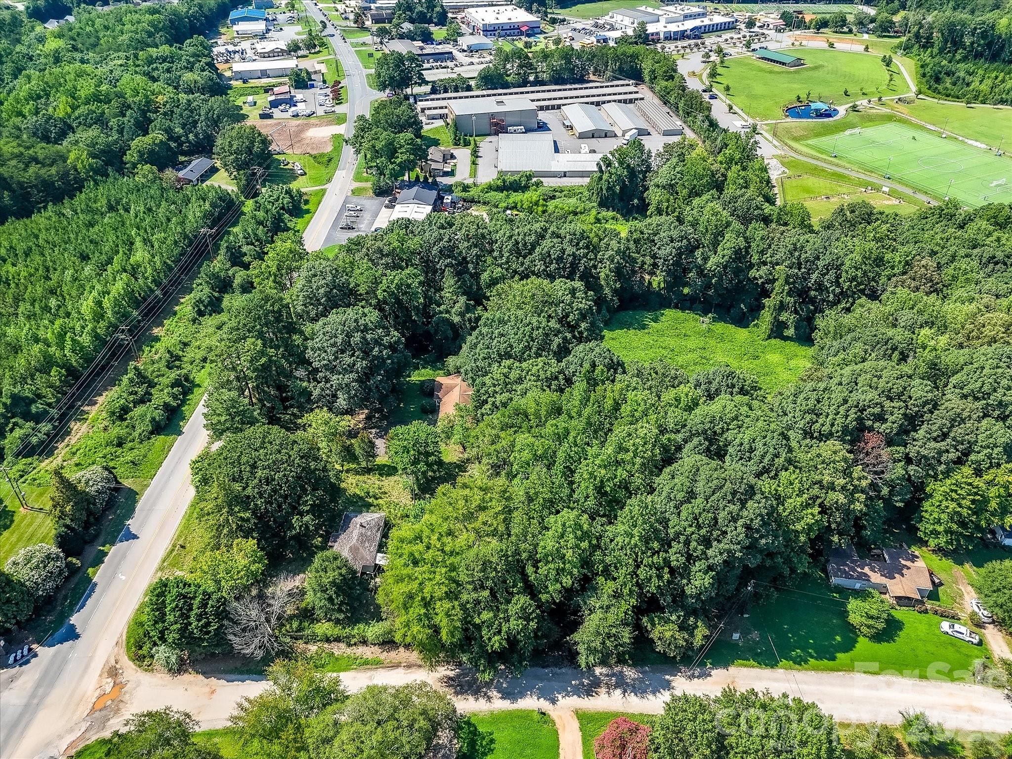 This Denver, NC commercial opportunity features a large, wooded parcel with existing improvements and exceptional redevelopment potential in one of the fastest-growing areas. - 1753 N NC Hwy 16 Business Highway, Denver