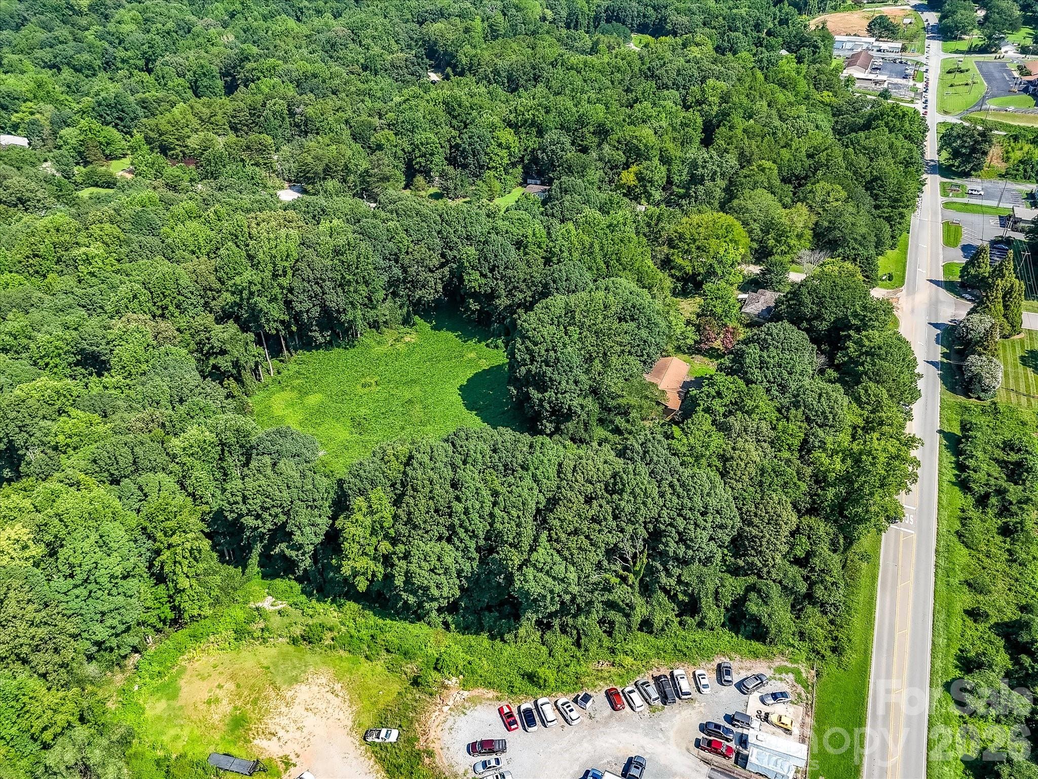 Expansive view showcasing the property's generous acreage, natural landscape, and strategic location within Denver's rapidly growing business district. - 1753 N NC Hwy 16 Business Highway, Denver