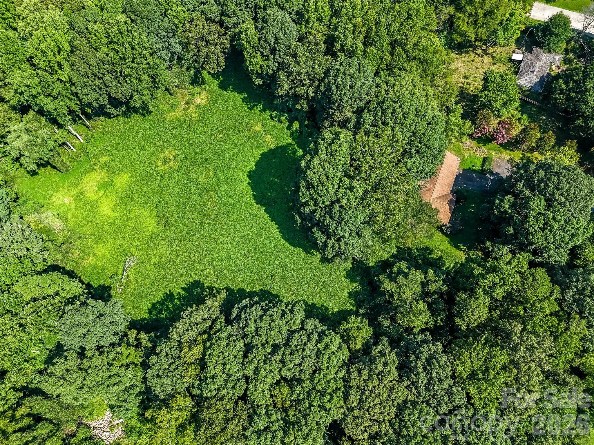 Expansive aerial view showcasing the property's generous acreage, natural landscape, and strategic location within Denver's rapidly growing business district. - 1753 N NC Hwy 16 Business Highway, Denver