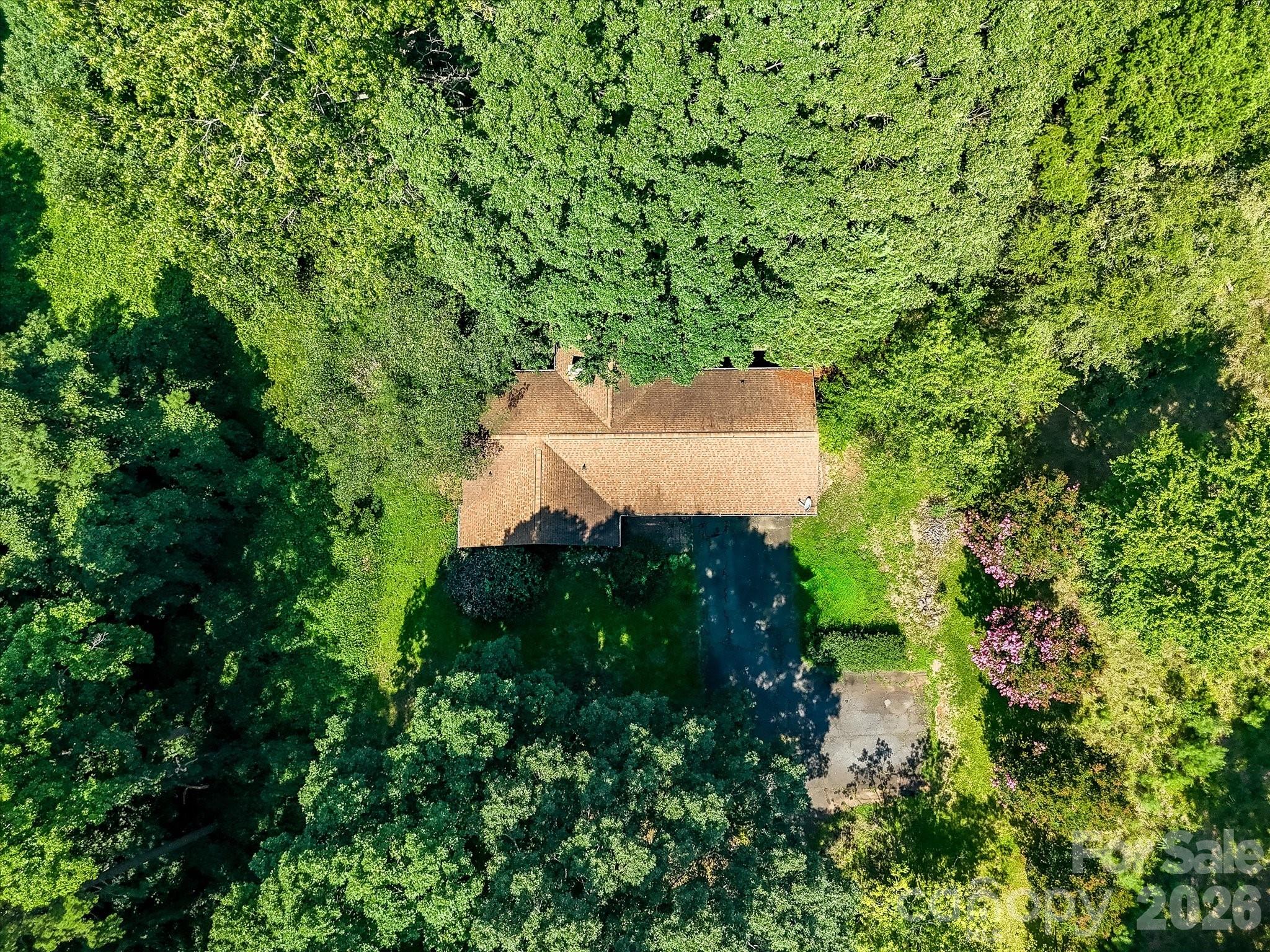 This Denver, NC commercial opportunity features a large, wooded parcel with existing improvements and exceptional redevelopment potential in one of the fastest-growing areas. - 1753 N NC Hwy 16 Business Highway, Denver