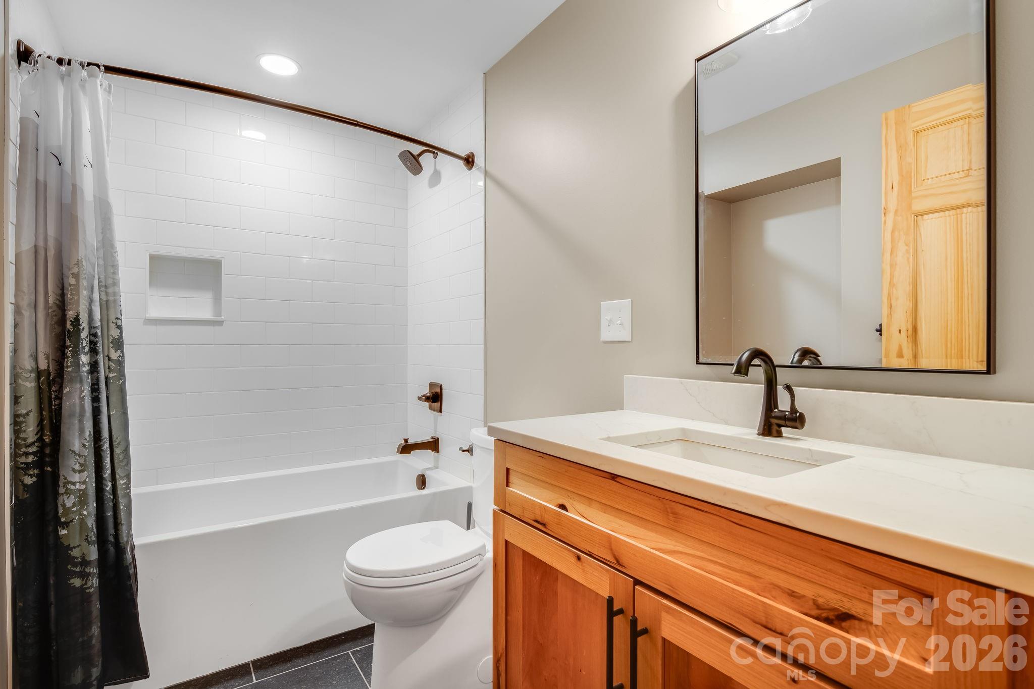 Full bathroom, serving the secondary living space - 10 Davenport Place, Asheville