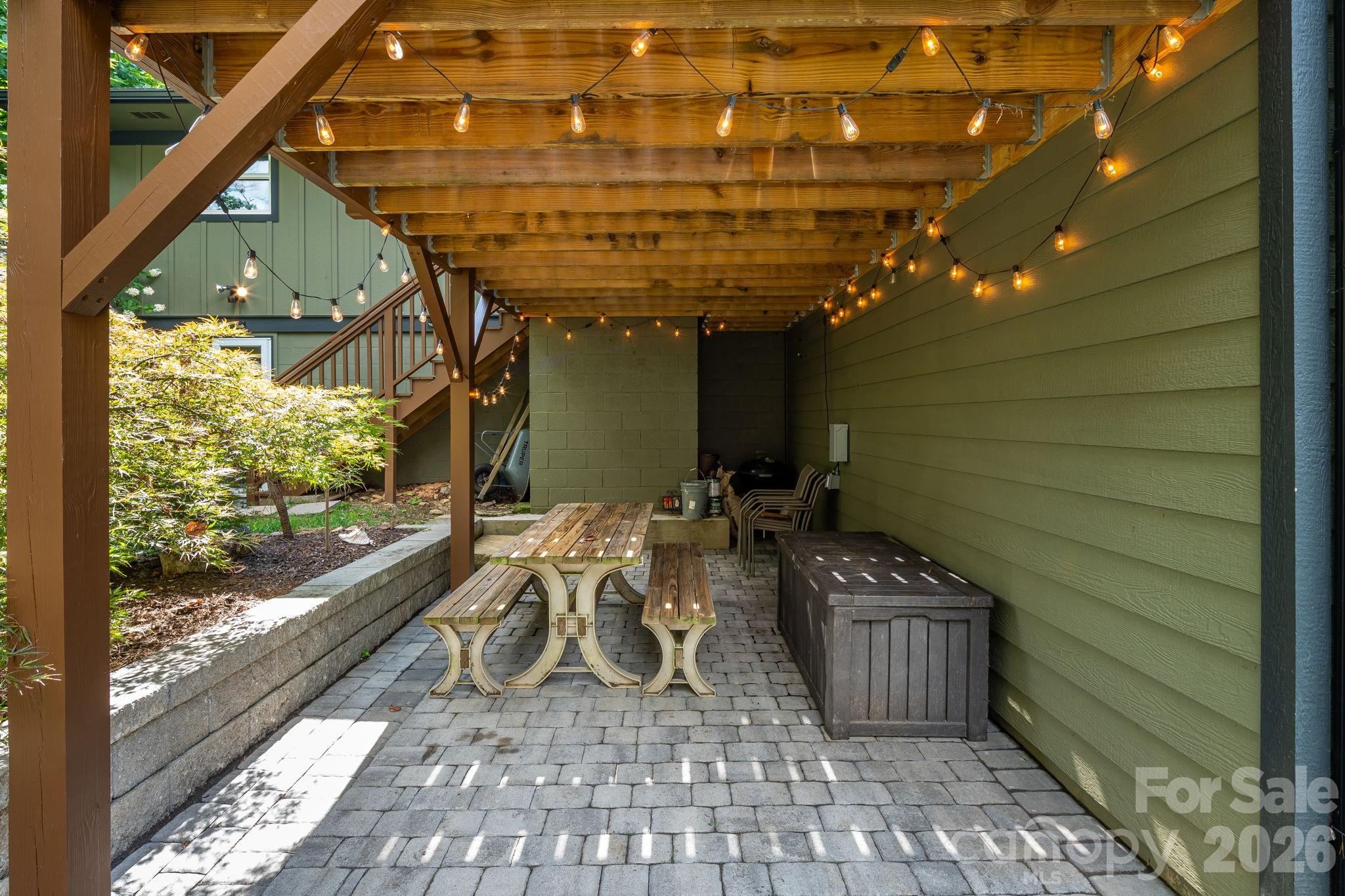 Inviting paved patio tucked beneath the deck - 10 Davenport Place, Asheville