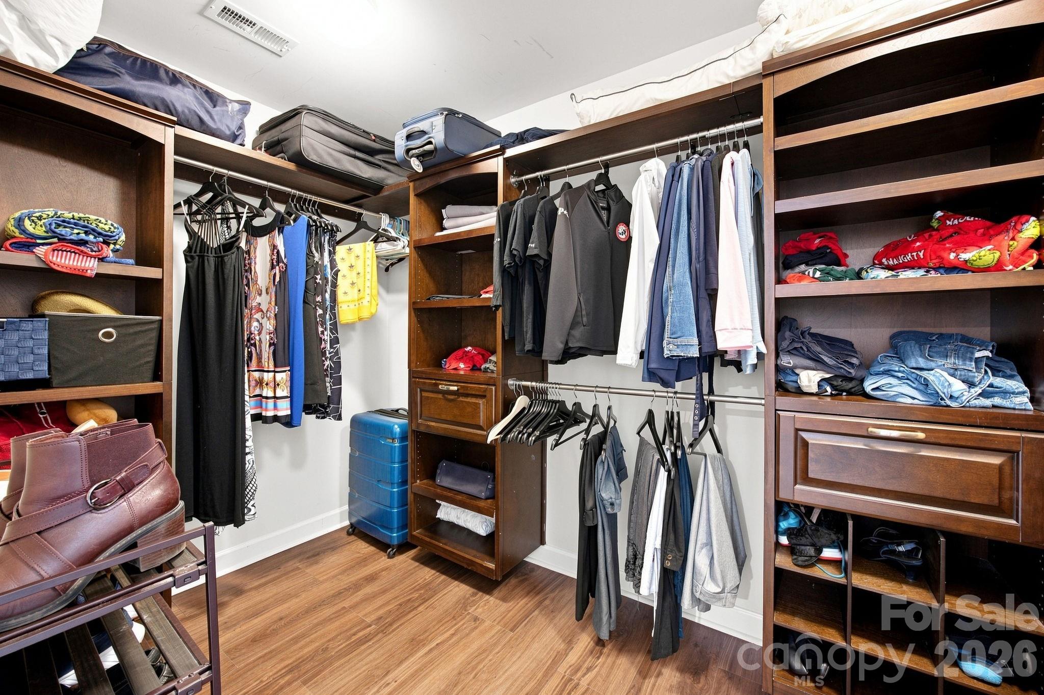Primary Closet! Tons of Space and custom shelving! - 2709 Sugaree Court, Waxhaw