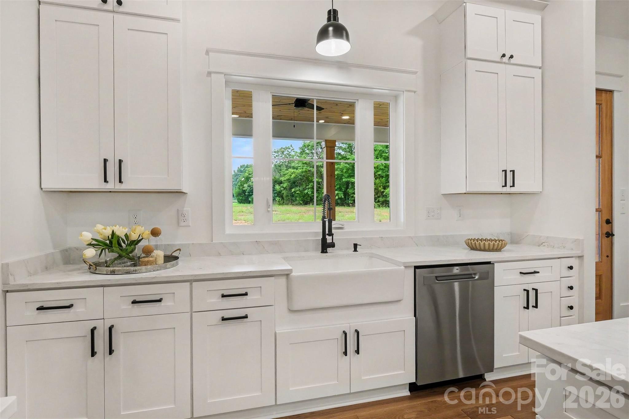 Yes, that's your new farm sink, overlooking the large backyard. - 6609 McNeely Road, Waxhaw