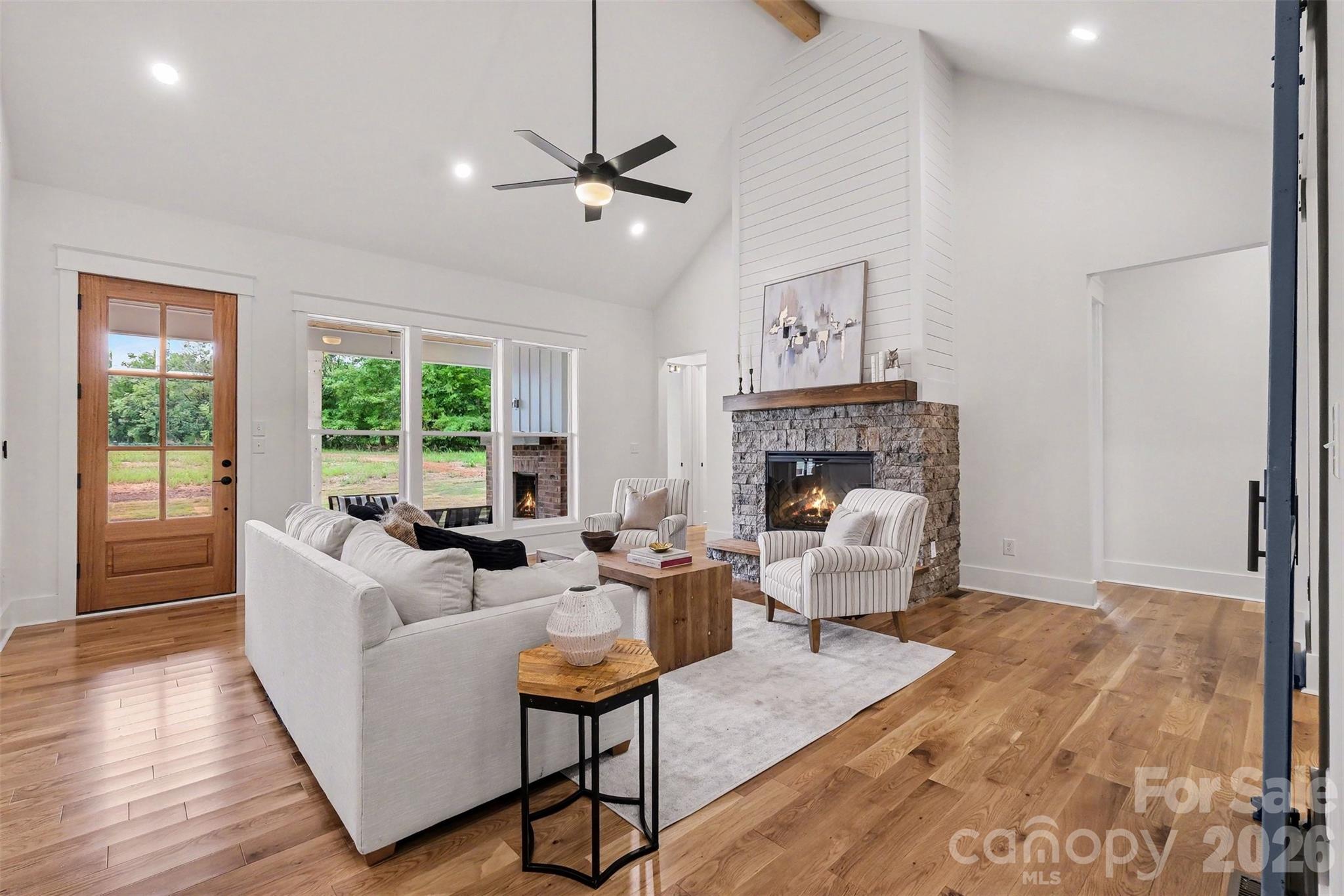 You'll love your new 19x20 great room that feels even bigger thanks to the vaulted ceiling with cedar beam. - 6609 McNeely Road, Waxhaw