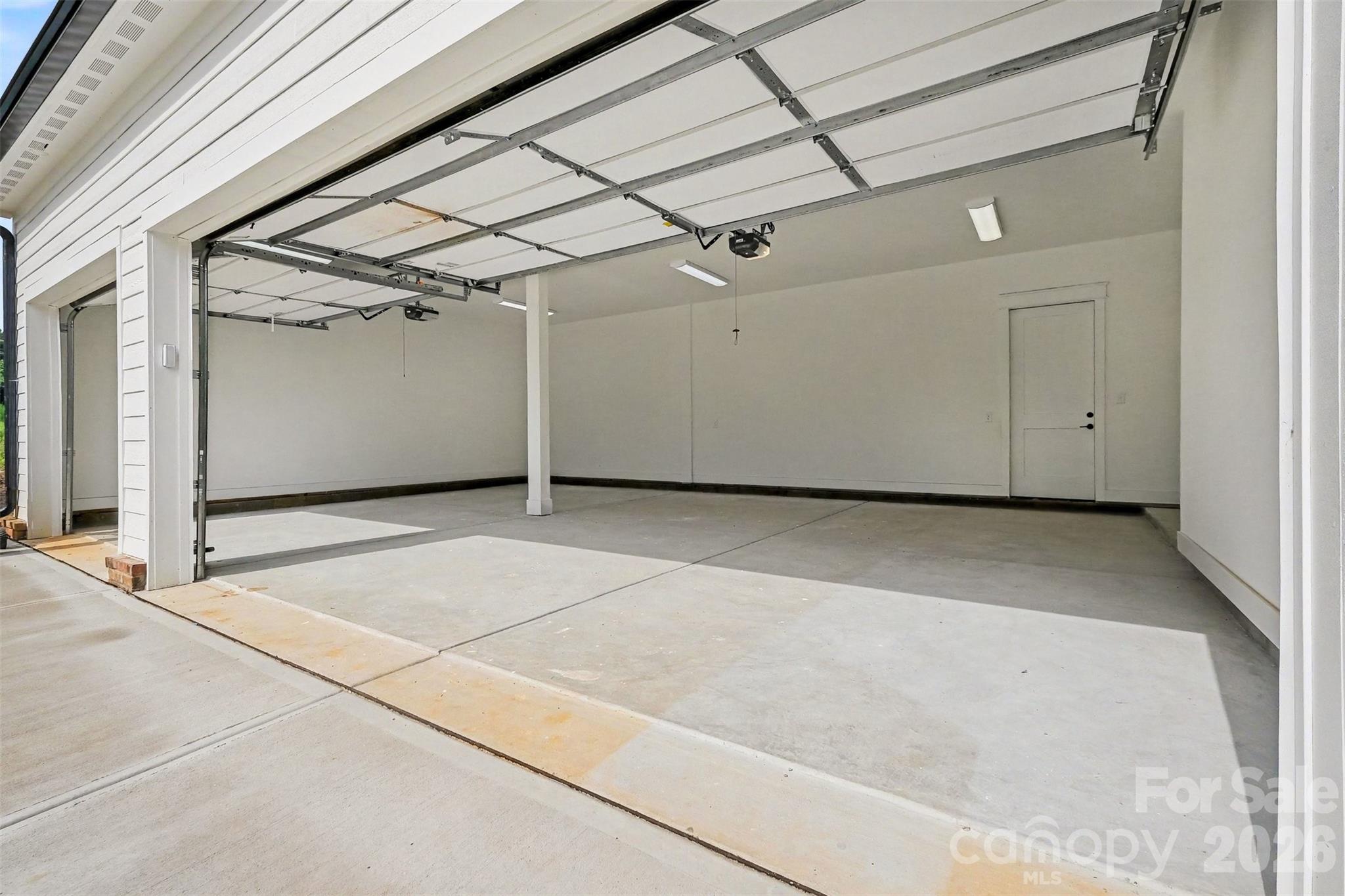 Your cars will live in luxury with your new 390-sf, 3-car garage. - 6609 McNeely Road, Waxhaw