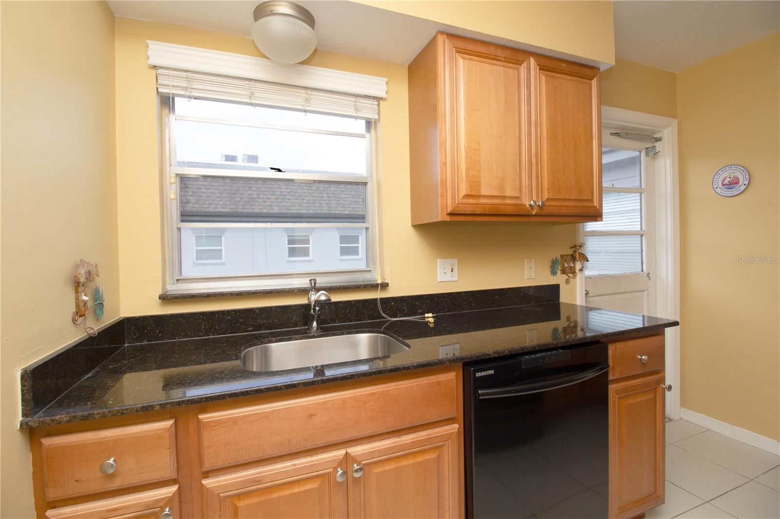 Kitchen showing private entrance - 6940 A SUNSET DR S #2C, ST PETERSBURG
