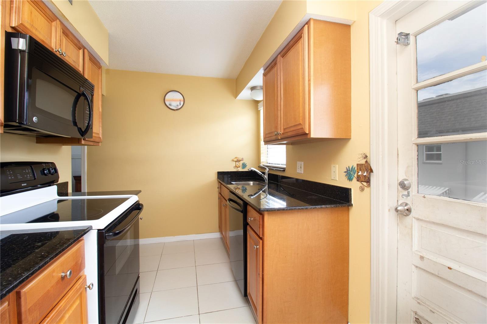 Kitchen showing private entrance - 6940 A SUNSET DR S #2C, ST PETERSBURG