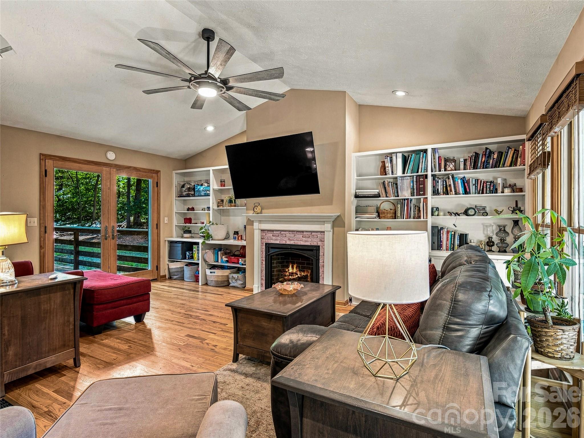 Cozy den with built-ins and remote contolled gas fireplace - 70 Promised Ridge Drive, Hendersonville