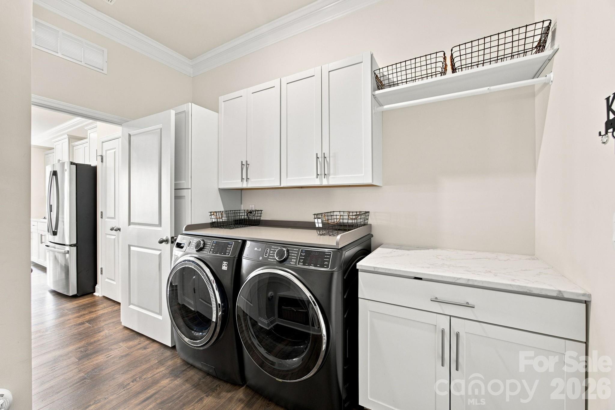 Laundry room up upgraded shelves and cabinets - 8125 Warford Little Road, Denver
