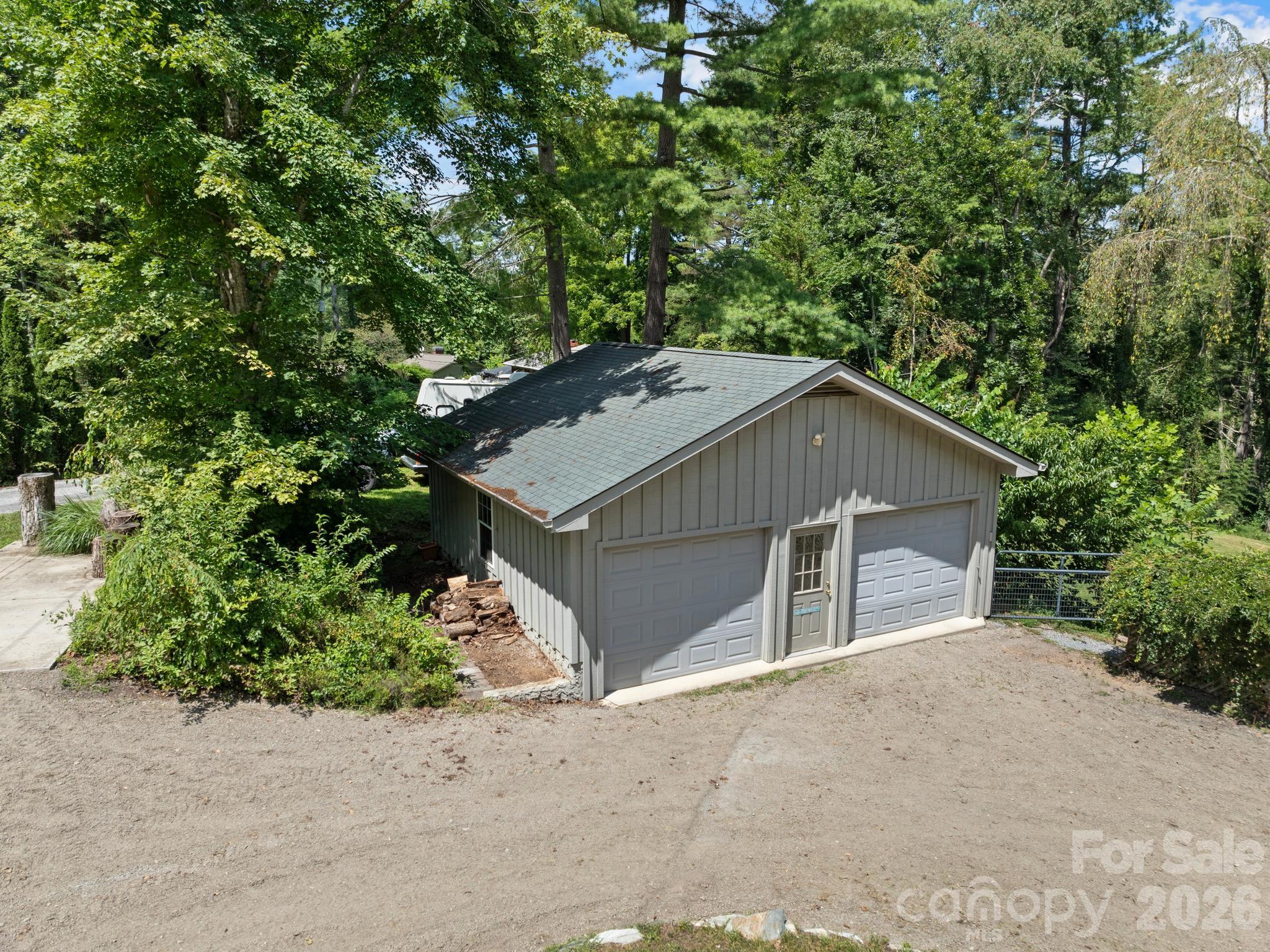 Detached 2 car garage with additional parking pad. - 242 N Hills Drive, Hendersonville