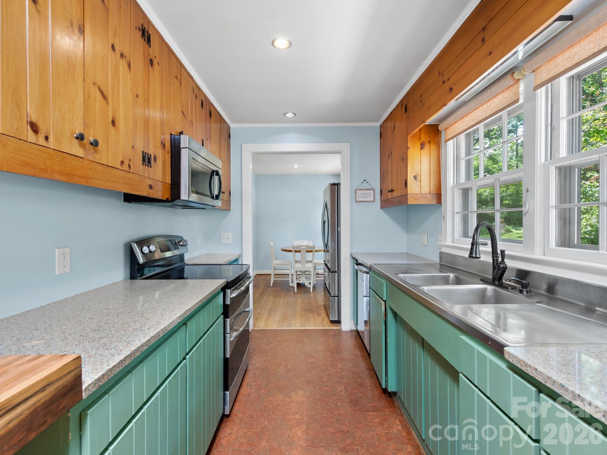 Galley kitchen with cork floors - 242 N Hills Drive, Hendersonville