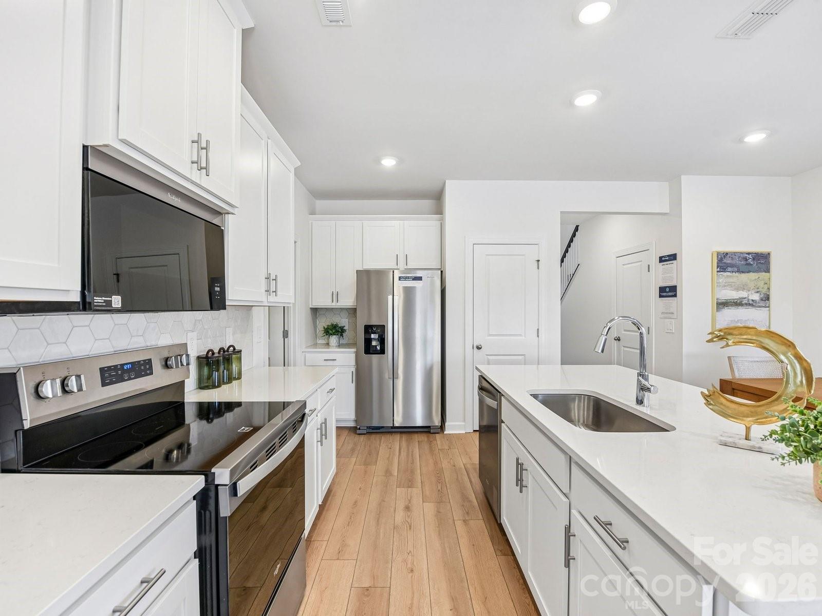 Photo is not of the actual home, but is an inspirational photo of builder’s model home and may depict options, furnishings, and/or decorator features that are not included - 3050 14th Avenue NE, Conover