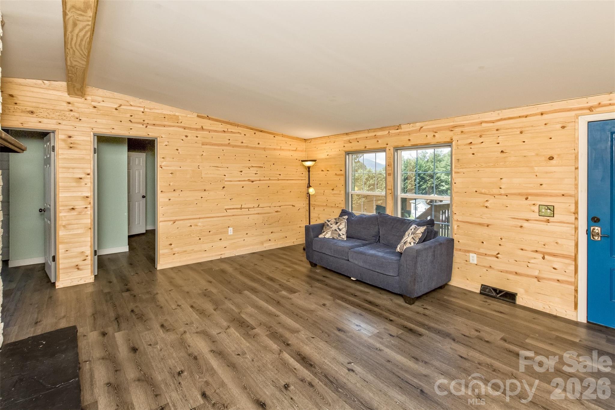 Another view of the living room, blue door out to the deck - 25 Asa Court, Black Mountain