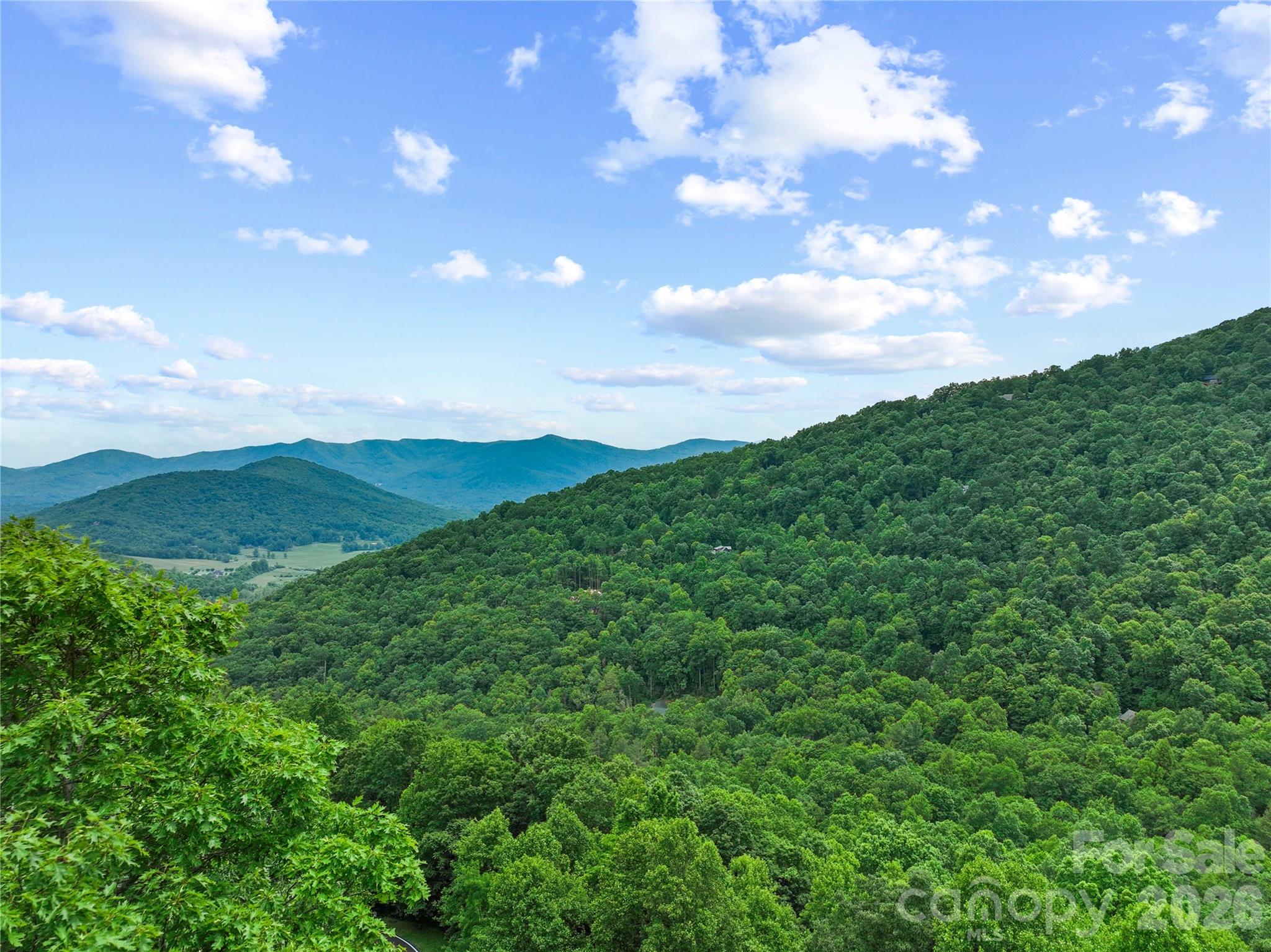 Overhead aerial from lot looking out at mountains. - 99999 Winding Poplar Road, Black Mountain