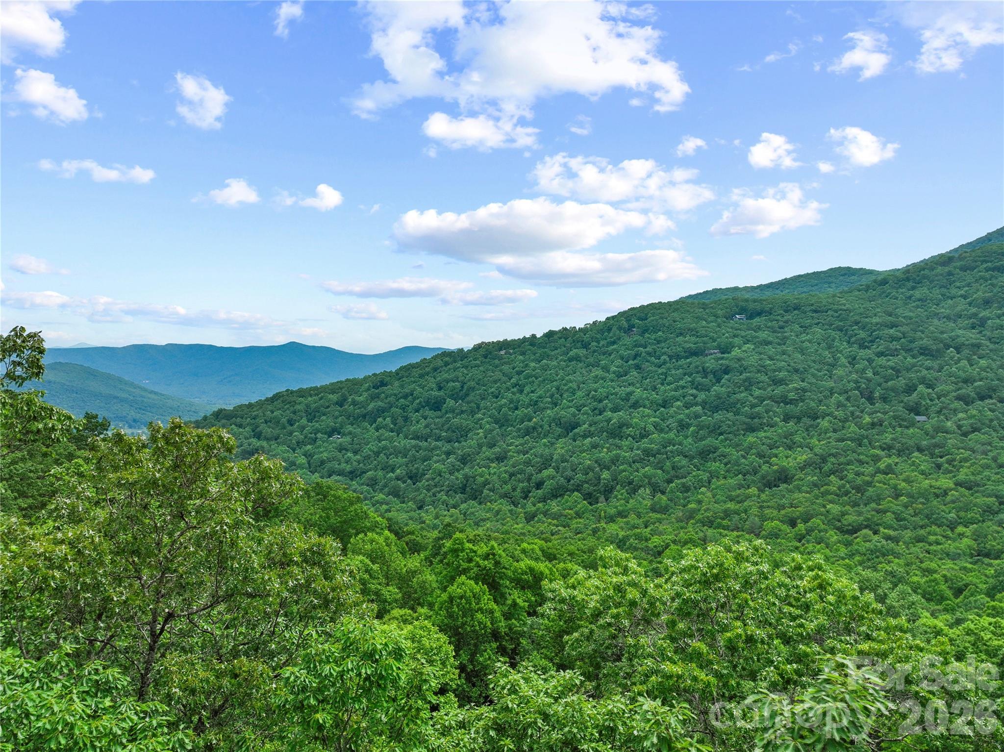 Another aerial from lot looking out at mountains. - 99999 Winding Poplar Road, Black Mountain