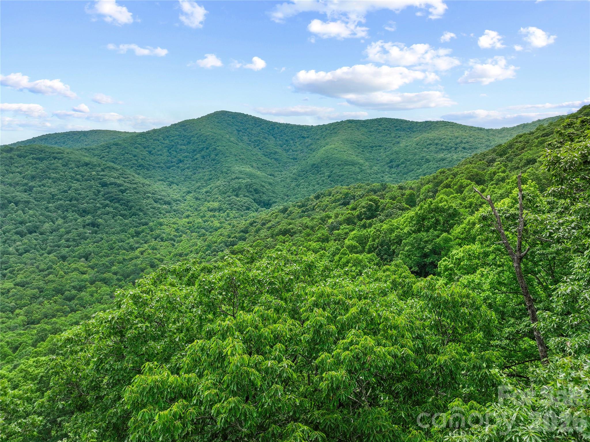 Still another aerial from lot looking out at mountains. - 99999 Winding Poplar Road, Black Mountain