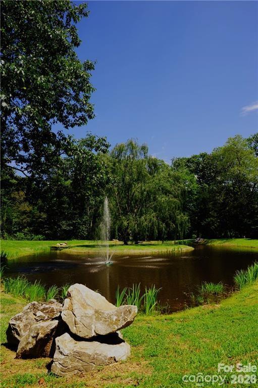 Fountain and pond approaching Laurel Ridge's gate. - 99999 Winding Poplar Road, Black Mountain