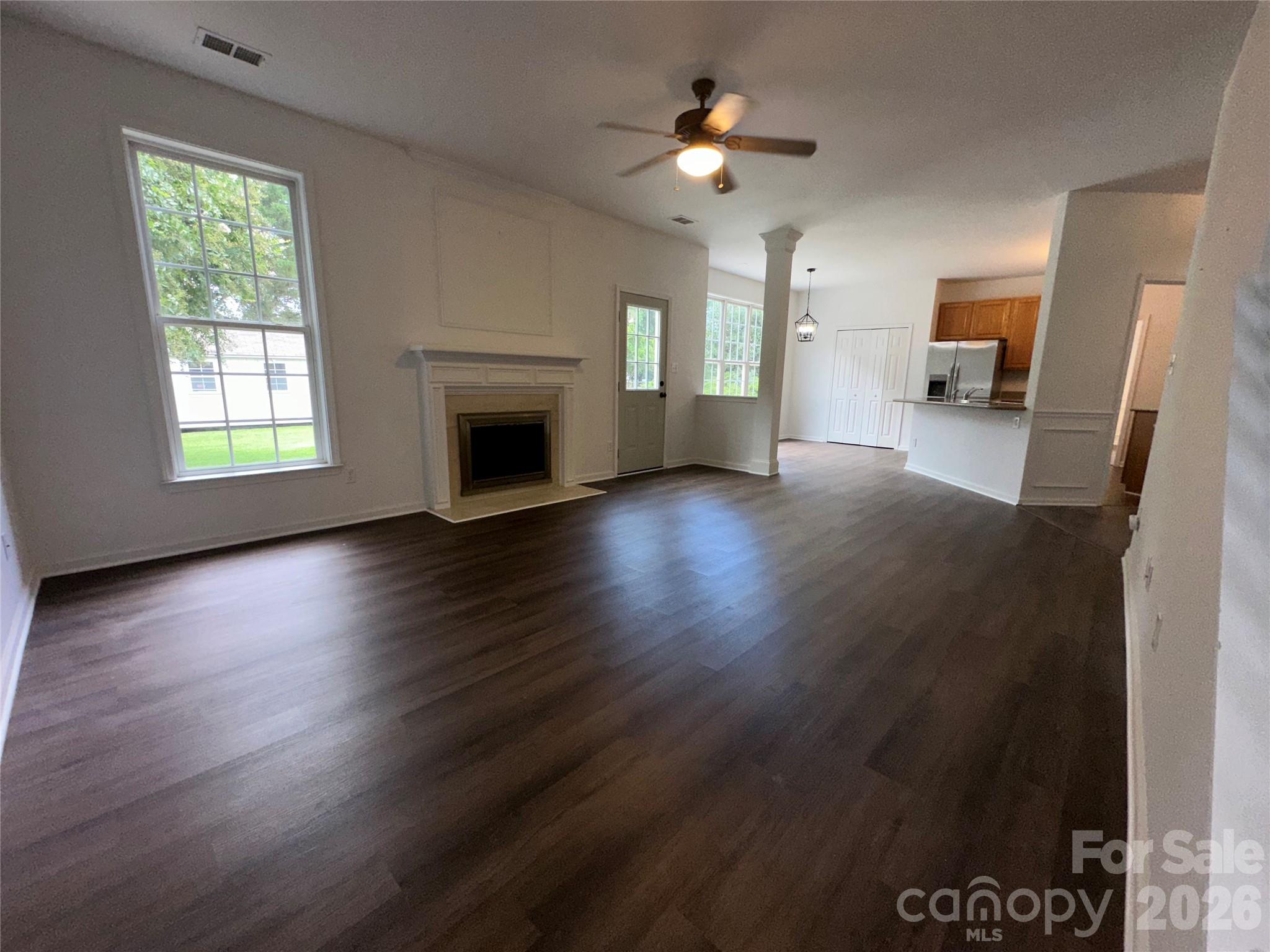 Entering Den from upstairs - 5867 Crimson Oak Court, Harrisburg