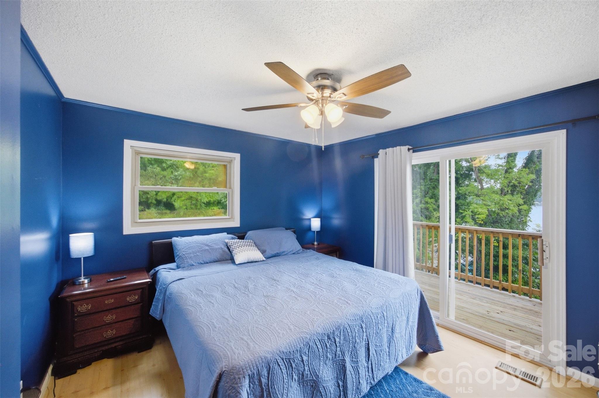 Primary bedroom with private deck and wonderful lake views! - 7016 Hyde Street, Sherrills Ford