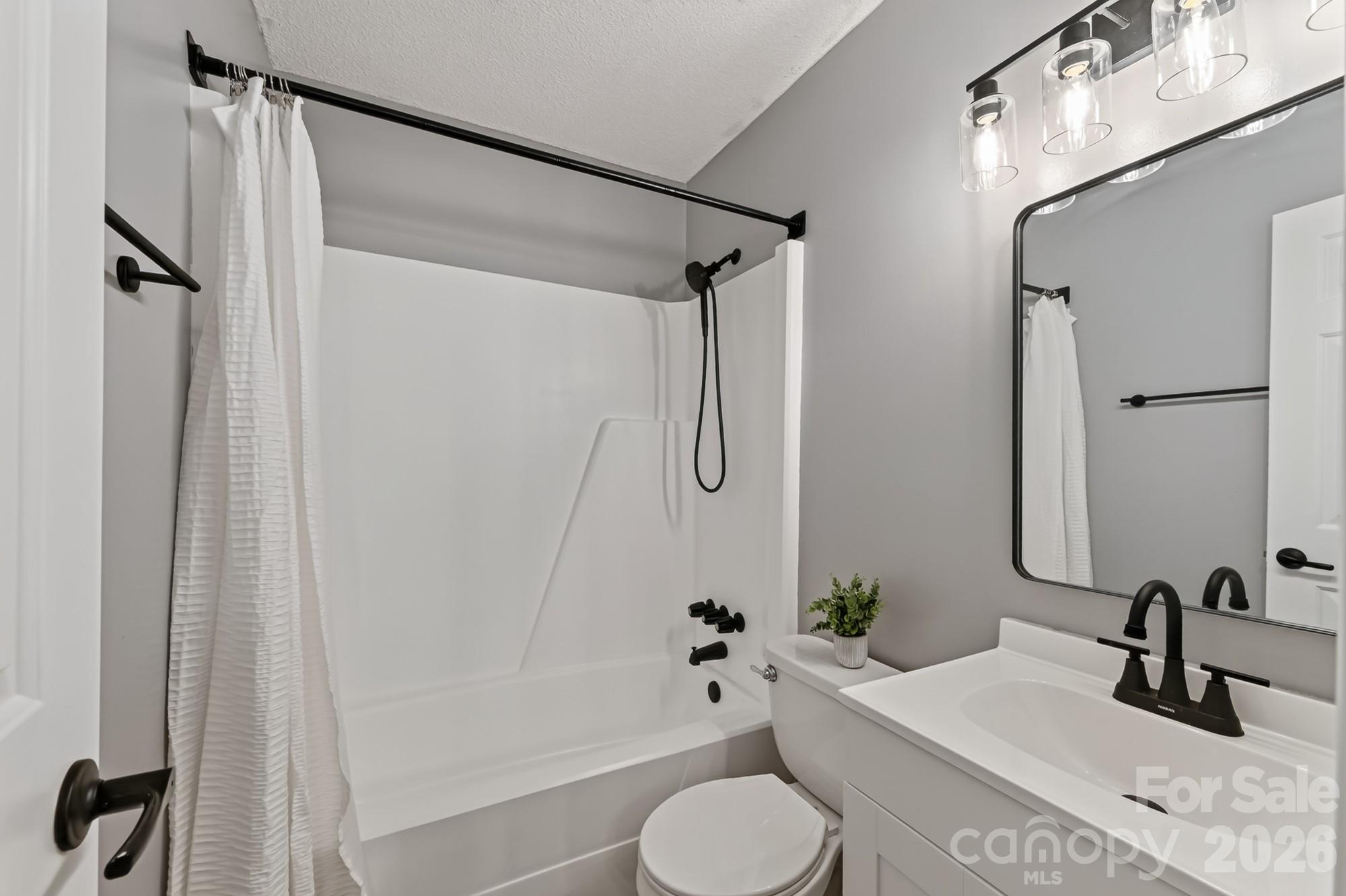 This part of the primary bath is in a private space, behind a door - 1620 Windyrush Lane, Gastonia