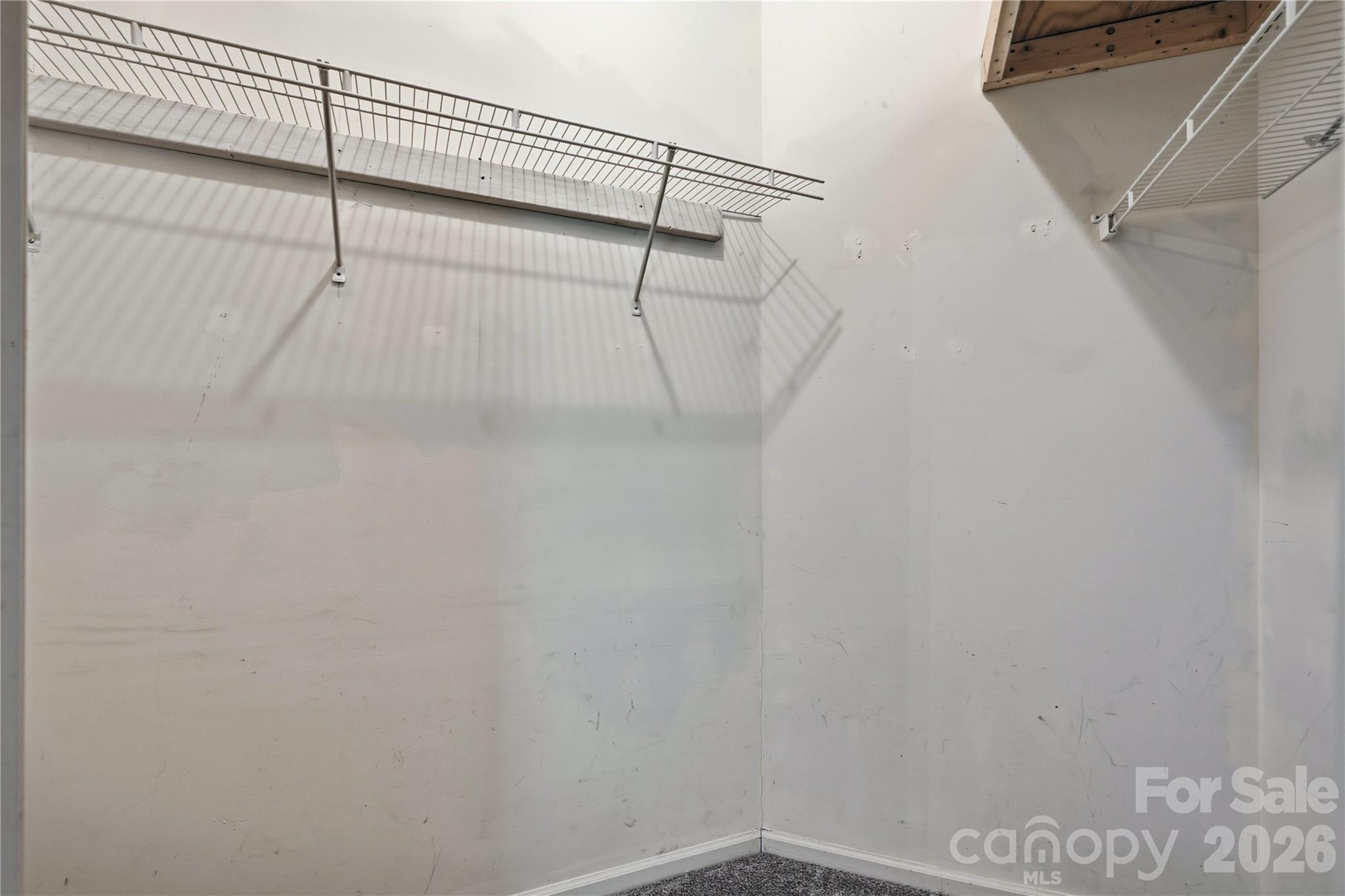 Walk in primary bedroom closet - 3555 Lake Bluff Drive, Sherrills Ford