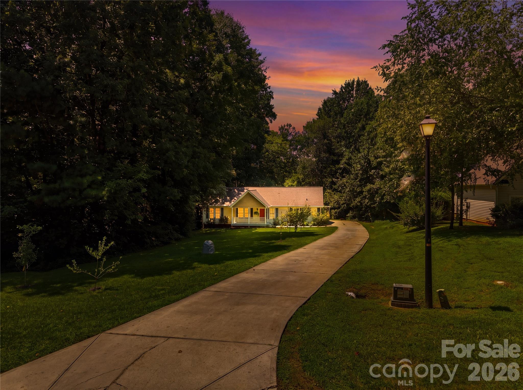 Beautiful twilight view of front of the home. - 3555 Lake Bluff Drive, Sherrills Ford