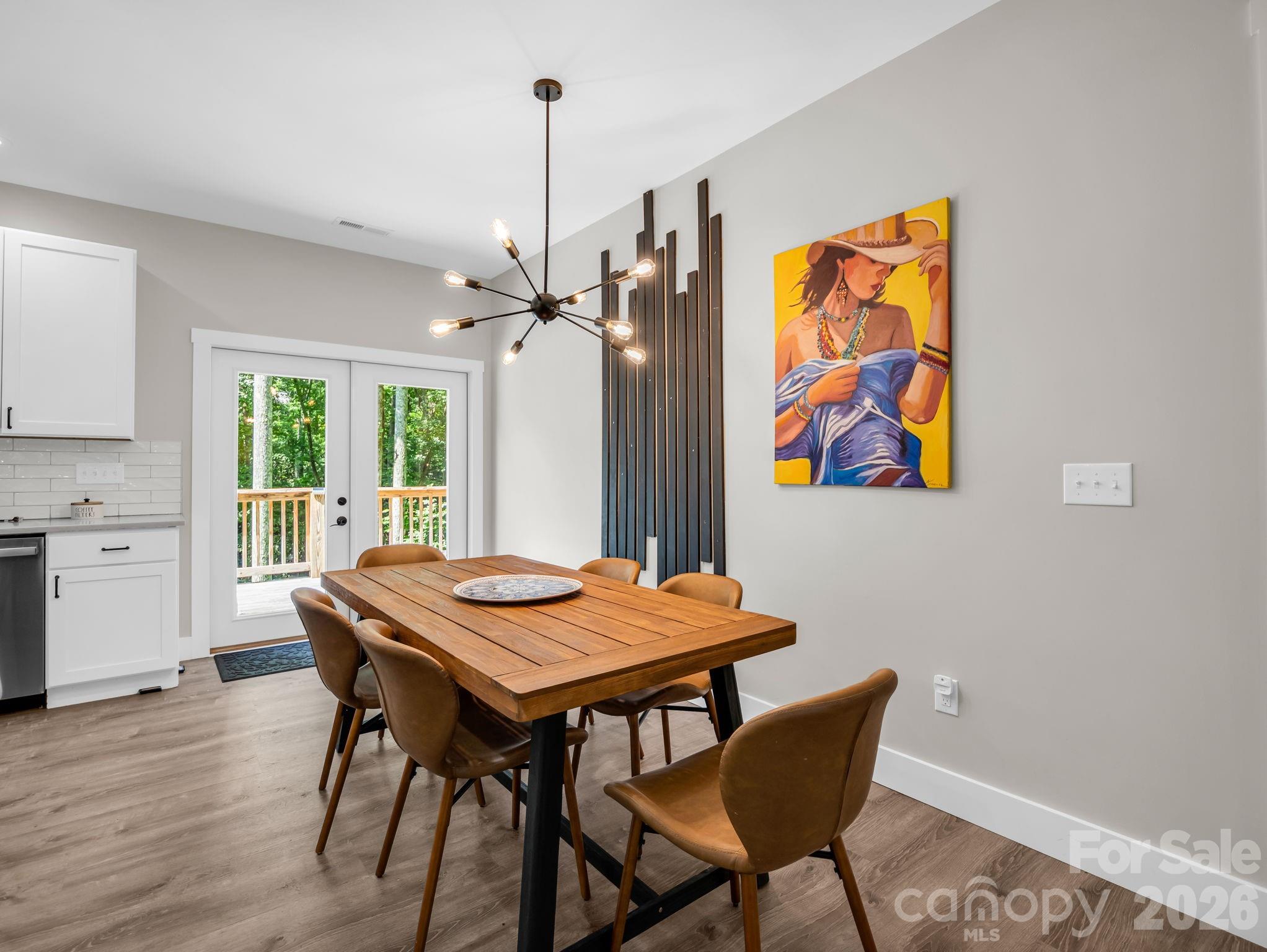 French doors off the dining area lead to the back deck. - 180 Ridgeview Drive, Hendersonville