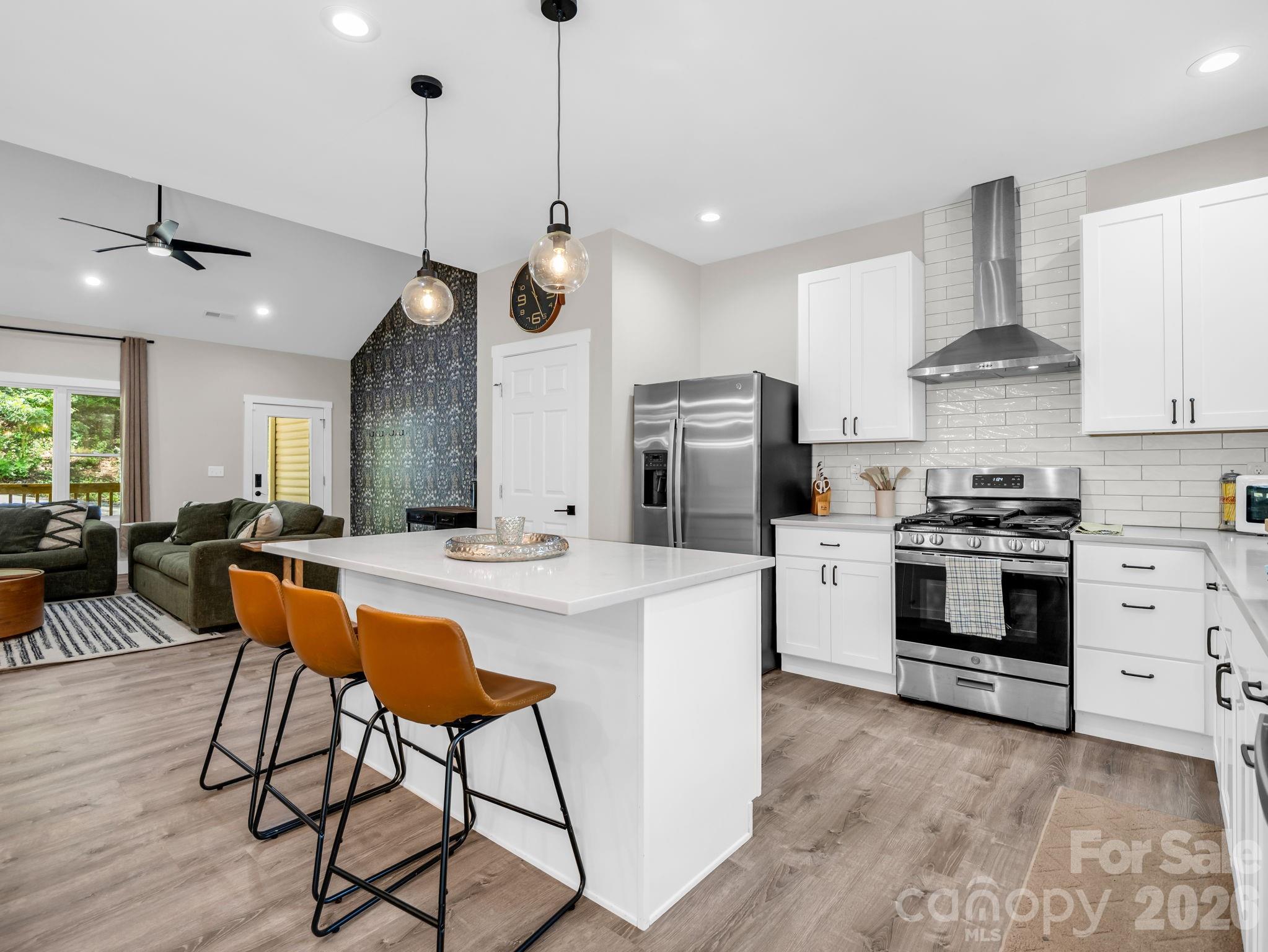 Gas Stove with stainless steel exhaust hood. - 180 Ridgeview Drive, Hendersonville