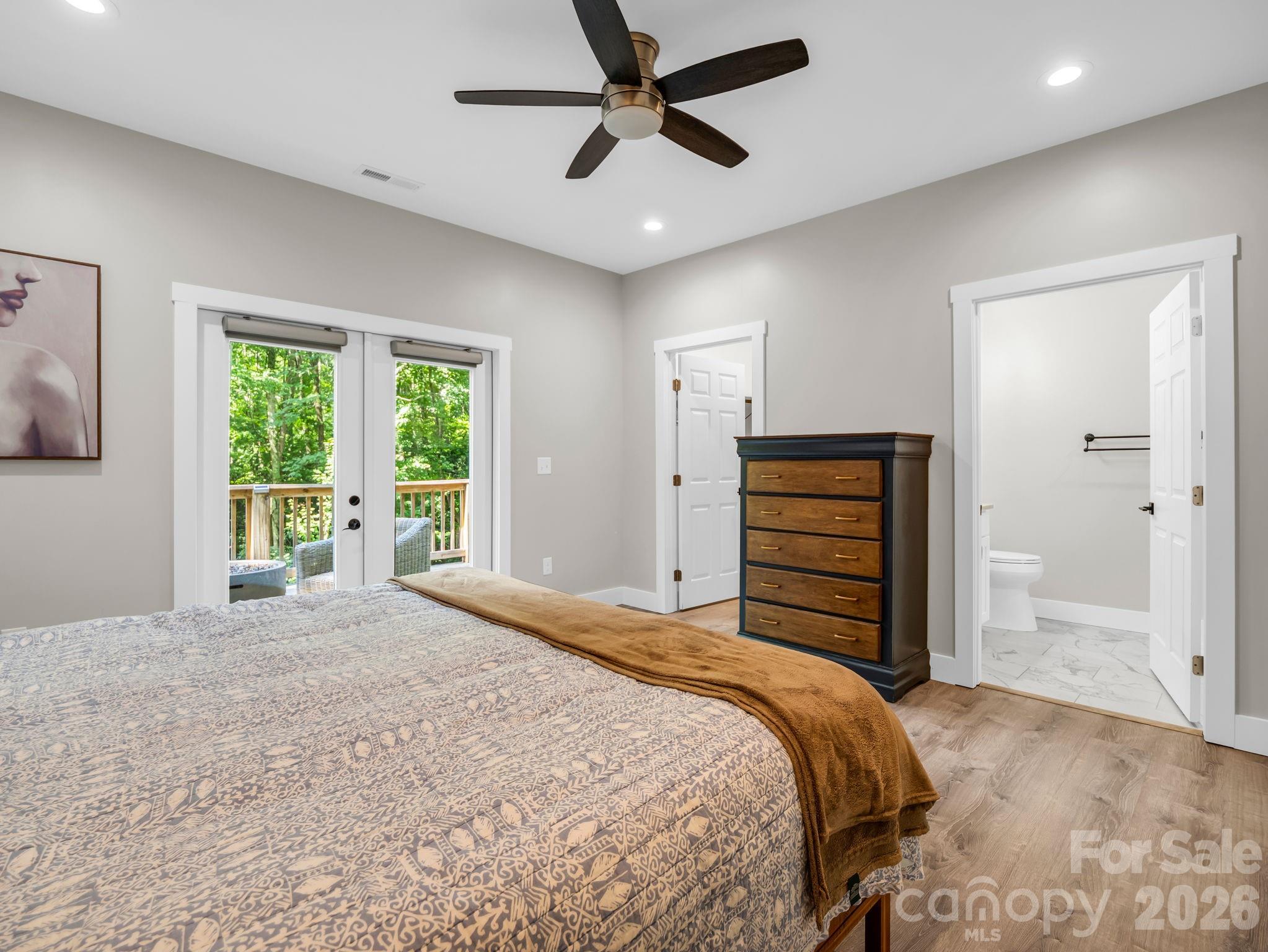 Primary bedroom, bathroom on the right and walk-in closet is the door on the left. - 180 Ridgeview Drive, Hendersonville