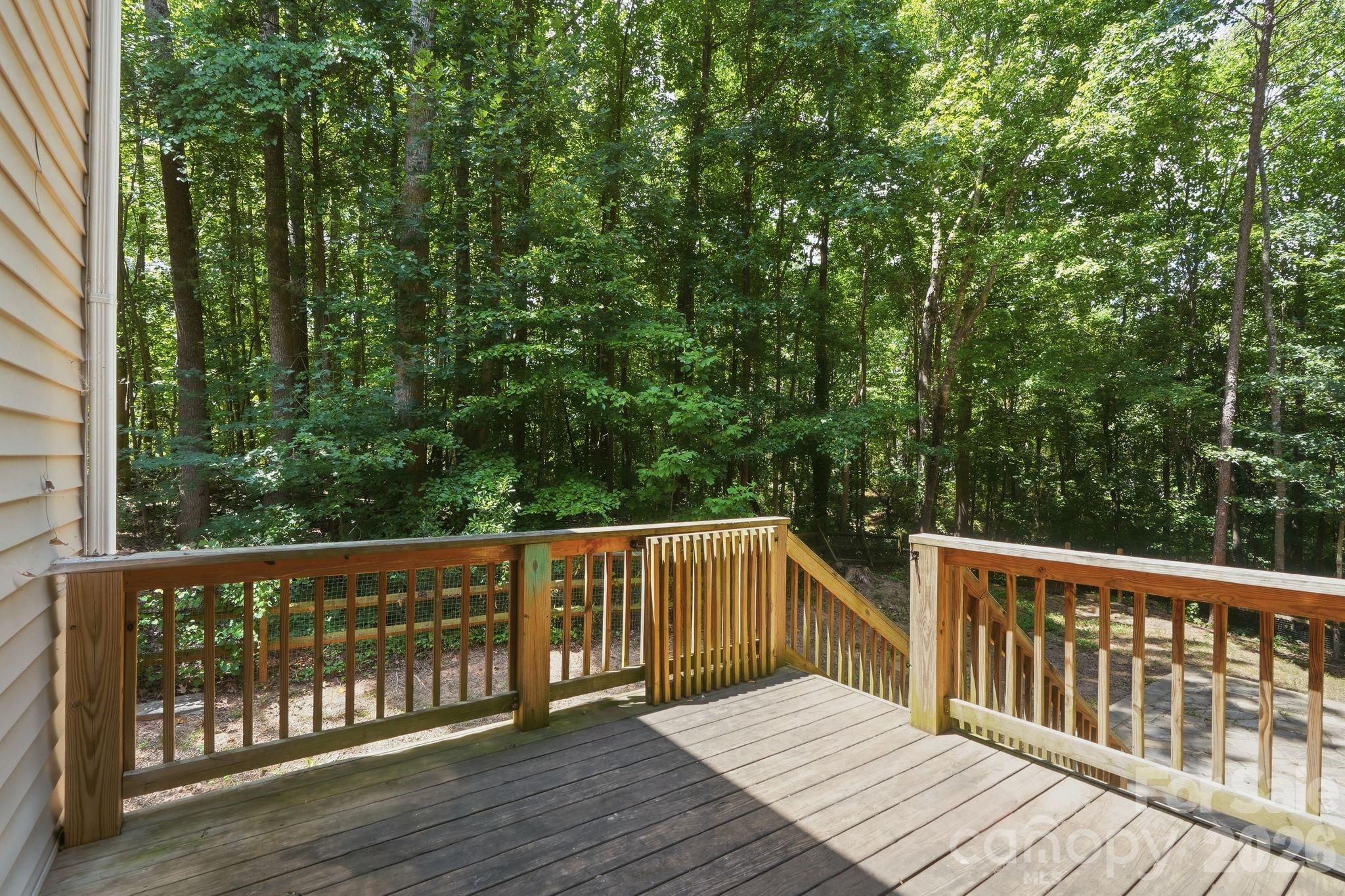 Back deck with wooded views. Deck has been powerwashed and restained. - 3675 W Bay Drive, Sherrills Ford