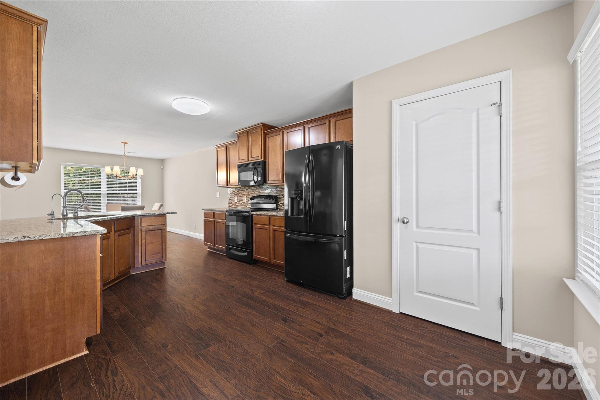 Premium granite countertops, and a full tile backsplash. - 848 Estuary Court, Rock Hill