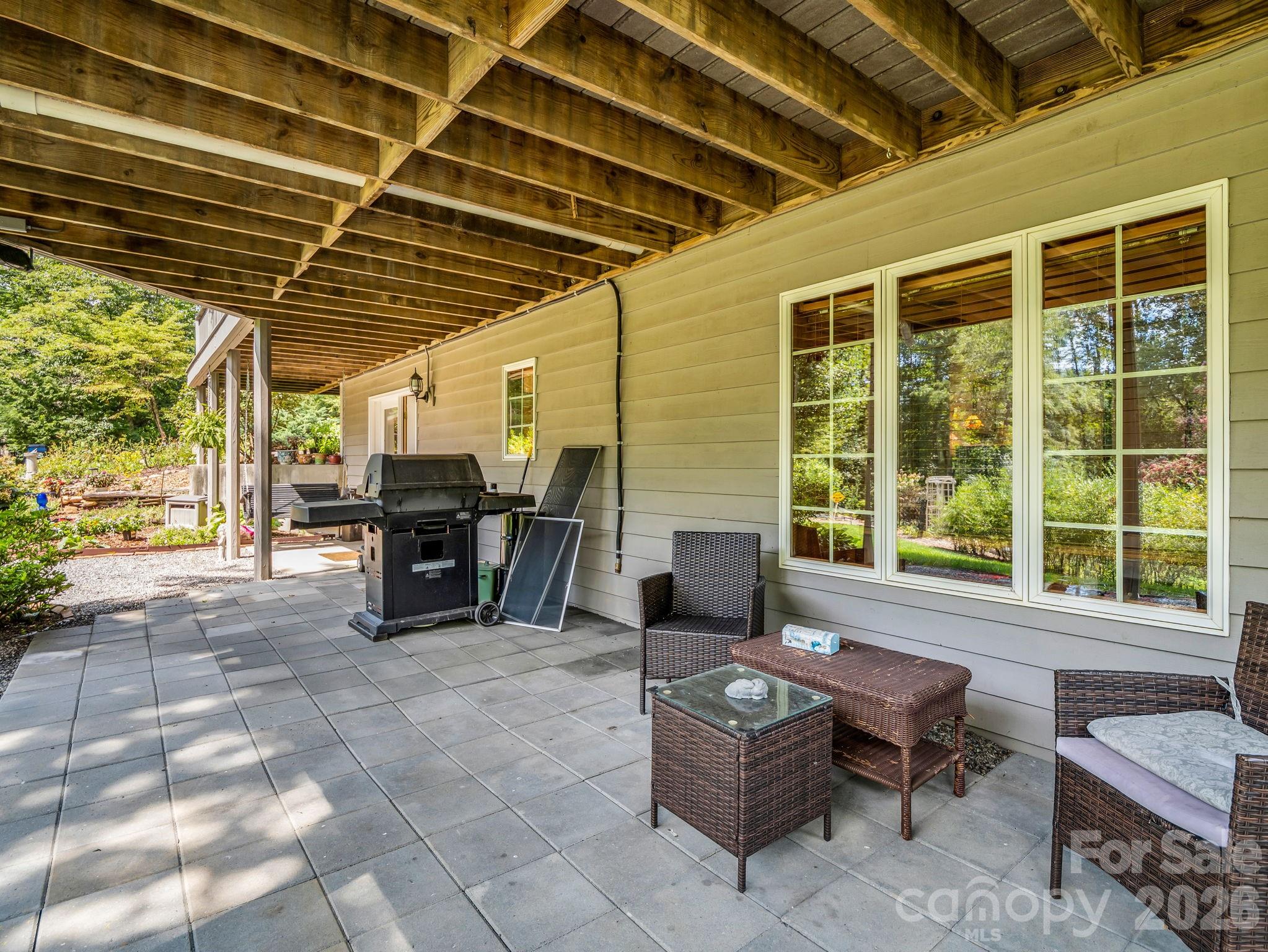 Patio on lower level, walkout from family room - 15 Ravenwood Drive, Fletcher