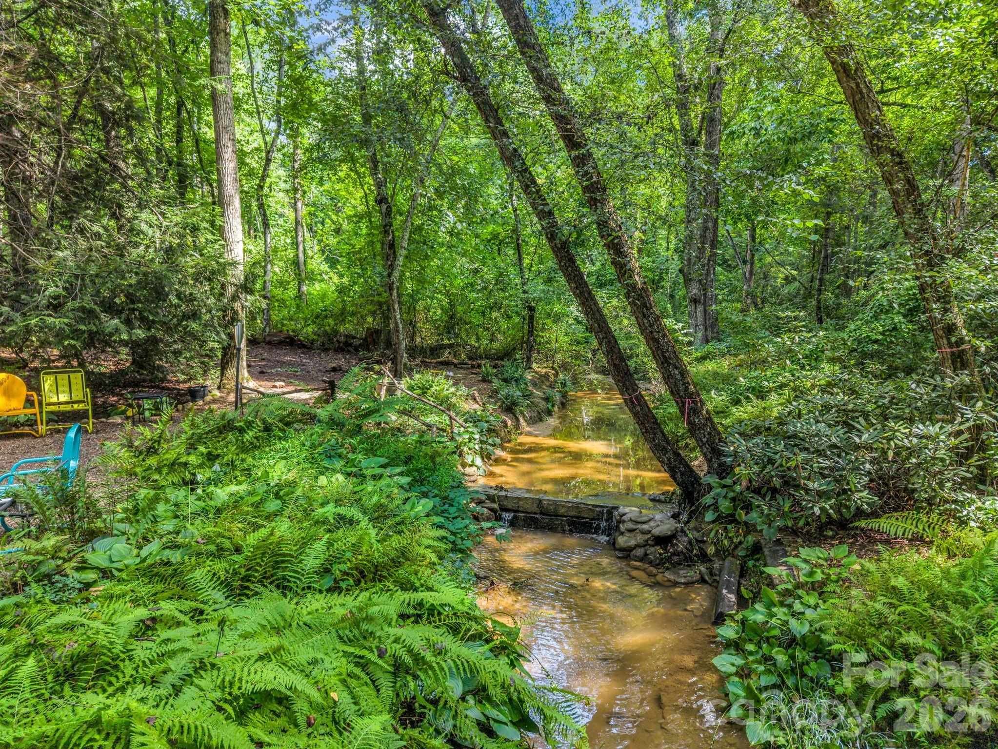 Stream runs through the back corner of the lot - 15 Ravenwood Drive, Fletcher
