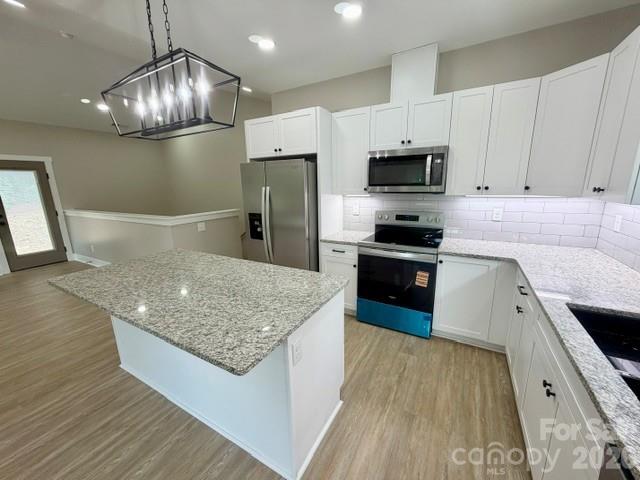 Love this kitchen! SS appliances, granite tops, cottage style cabinets - 1135 Pinebrook Avenue SE, Valdese