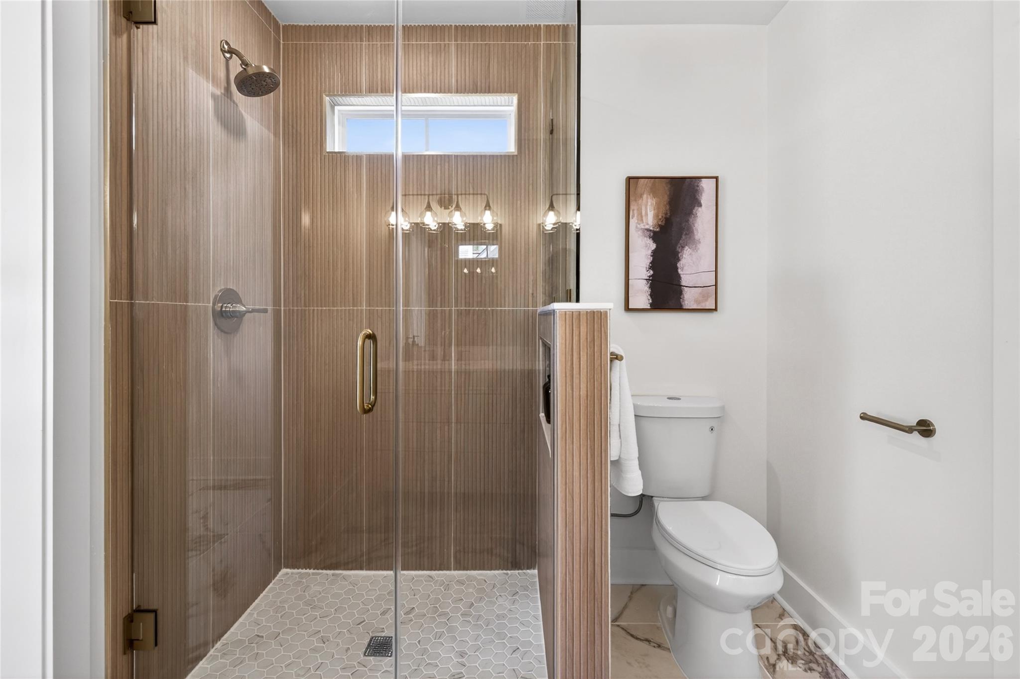 Beautifully tiled walk in shower with frameless glass door - 309 W Gold Street, Kings Mountain