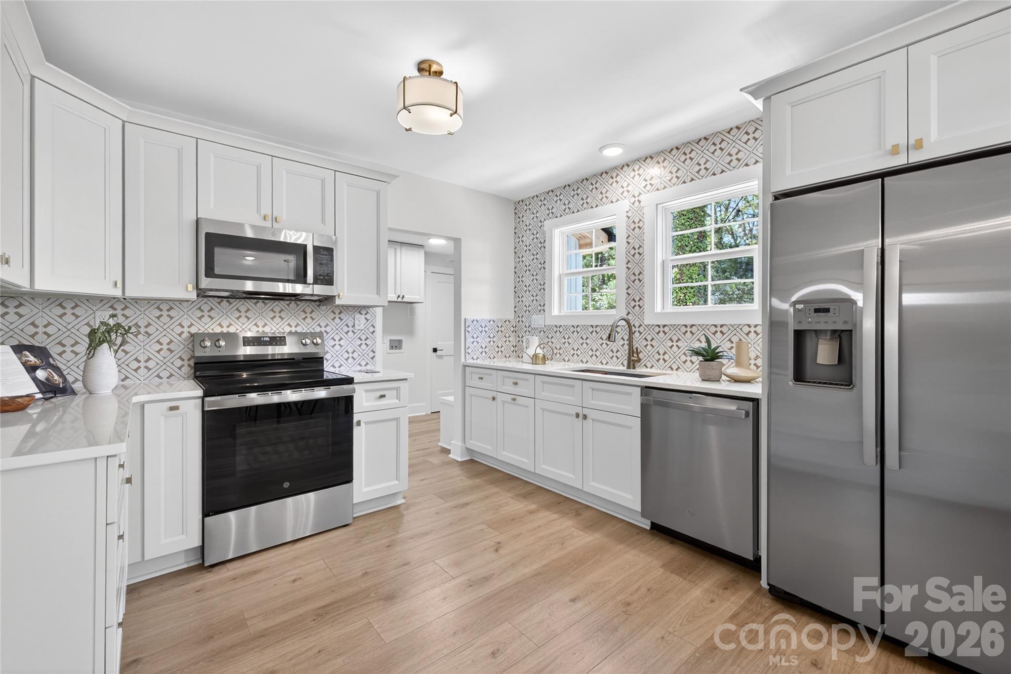 Kitchen includes soft close cabinets, quartz countertops and all appliances - 309 W Gold Street, Kings Mountain