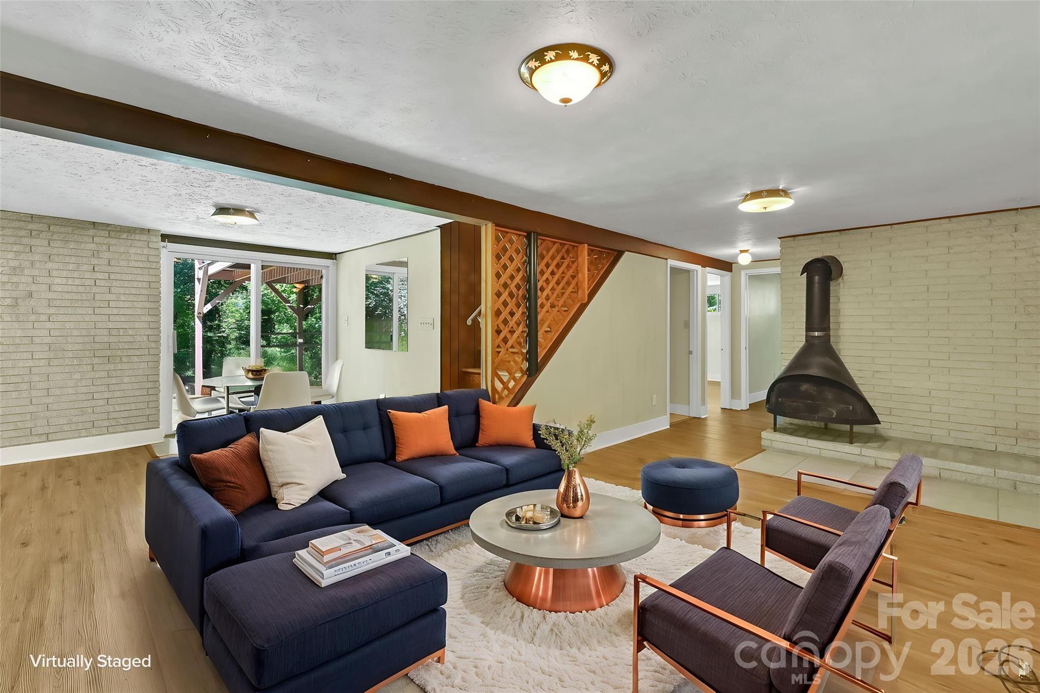 downstairs living area virtual staging - 297 White Pine Drive, Asheville