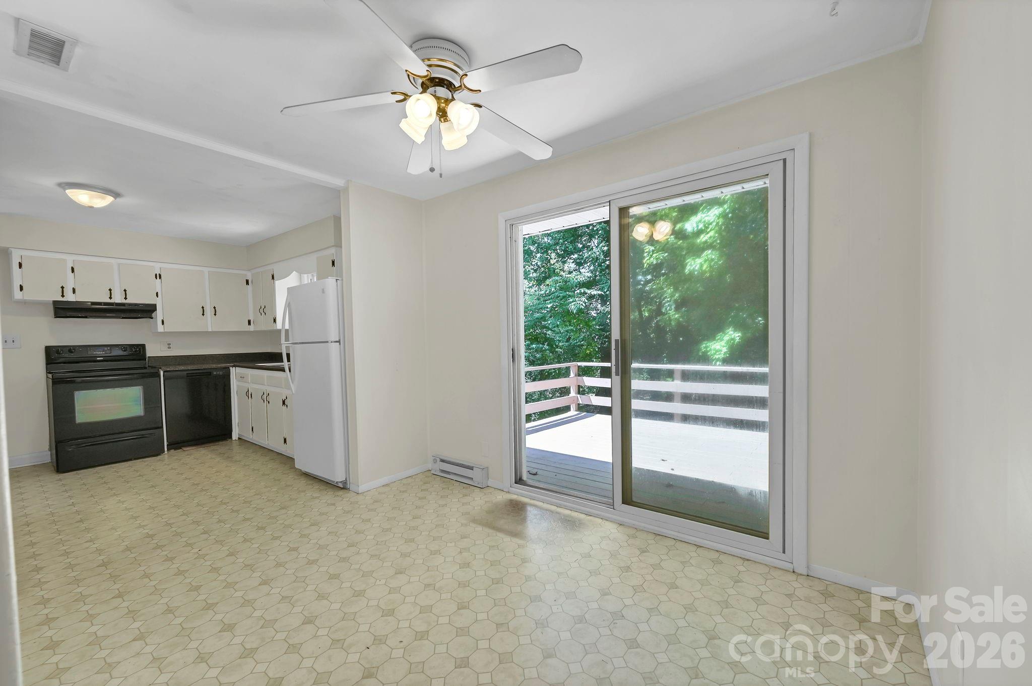dining area to deck - 297 White Pine Drive, Asheville