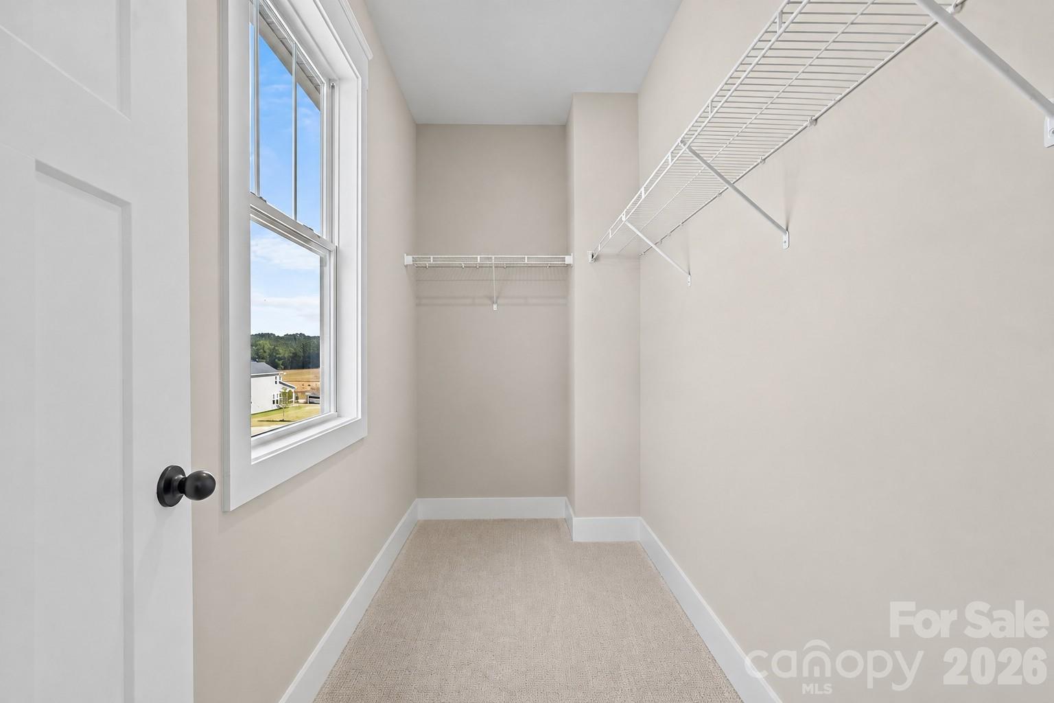 Bedroom #4 Expansive Walk-in Closet - Model Home, For Reference Only. - 3031 Grandiose Drive, Indian Trail