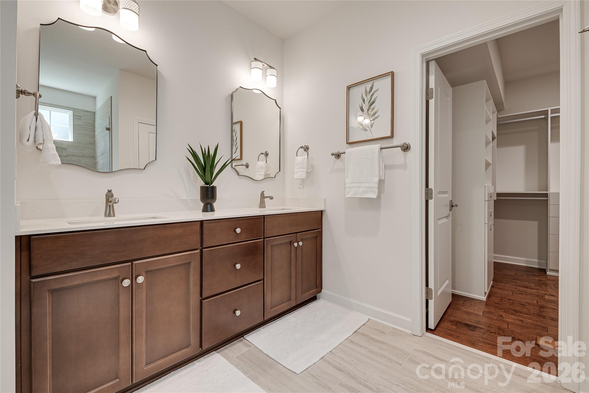 Beautiful double sink vanity with under mount sinks in the primary bathroom. - 2566 NW Red Hill Street, Concord